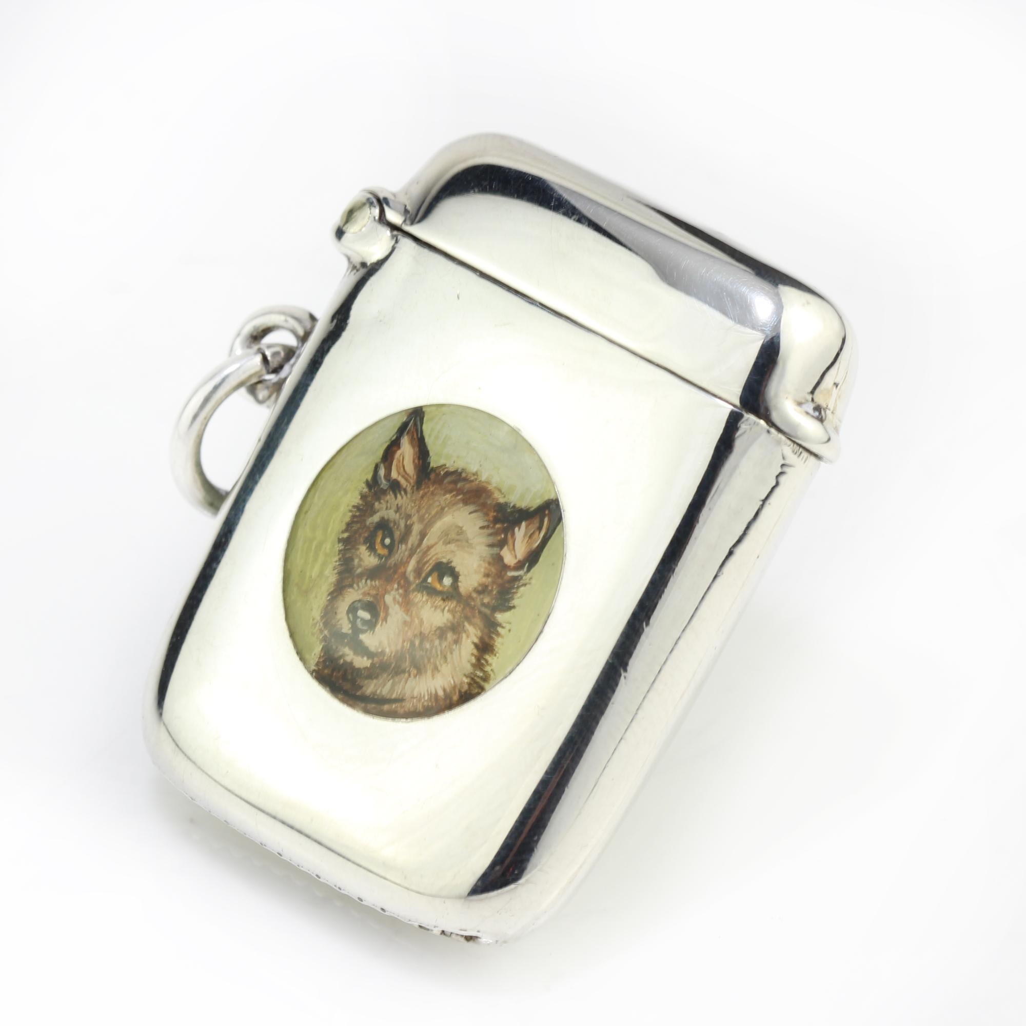Antique sterling silver vesta case with enamel portrait of dog
Made in Birmingham 1913
Maker: W J Myatt & Co 

Dimensions - 
Size: 3.6 x 3 x 0.8 cm
Weight: 15 grams

Condition: Minor signs of usage and age, great overall condition.