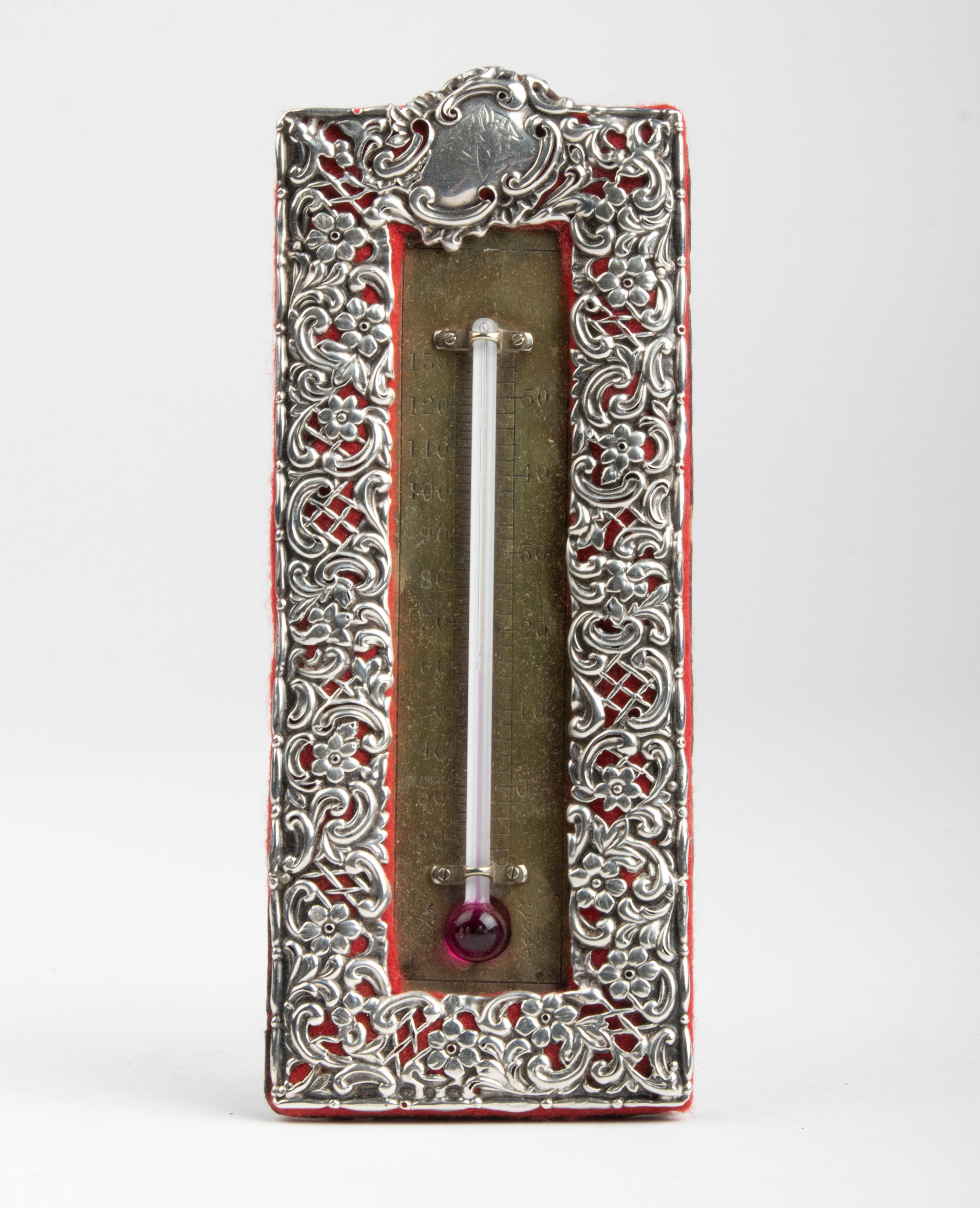 Beautiful antique Victorian thermometer. The front is made of sterling silver. This is marked with the hallmarks of Birmingham 1887 (year letter N) and the maker H. Matthews. This English maker produced a wide variety of silverware in the late 19th
