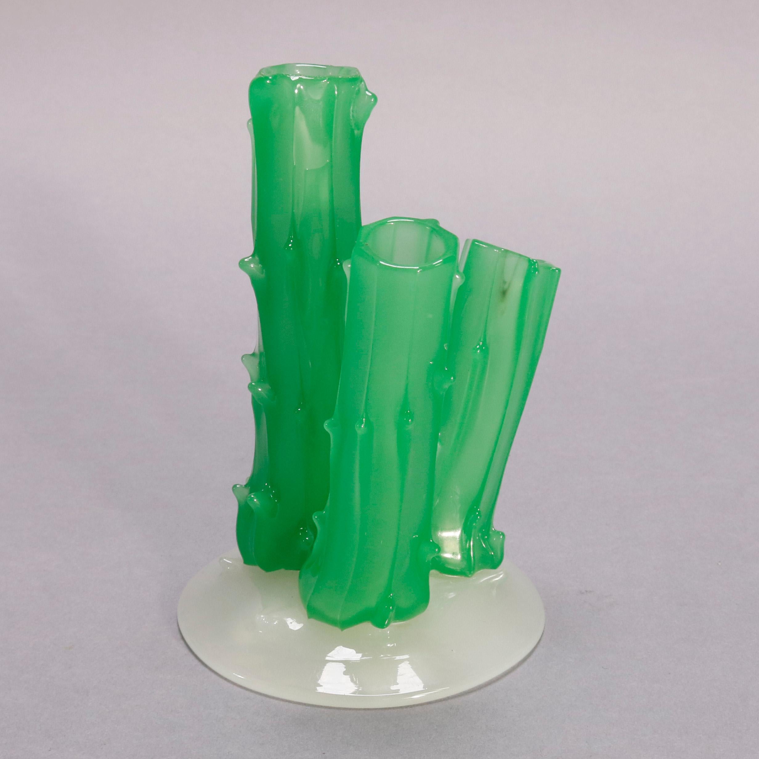 An antique Steuben Carder art glass vase offers three prongs having trunk form in jade green and mounted on calcite base, signed on base, circa 1920

Measures: 6.25