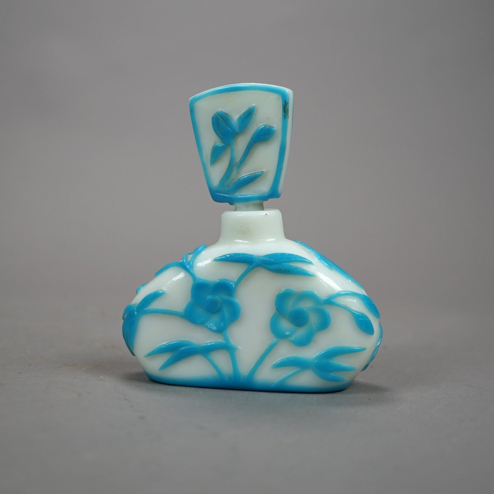 An antique Arts & Crafts perfume bottle by Steuben offers aqua cut back art glass construction with floral design and includes stopper, unsigned, c1920

Measures - 5''H x 4.25''W x 1.5''D.

Catalogue Note: Ask about DISCOUNTED DELIVERY RATES