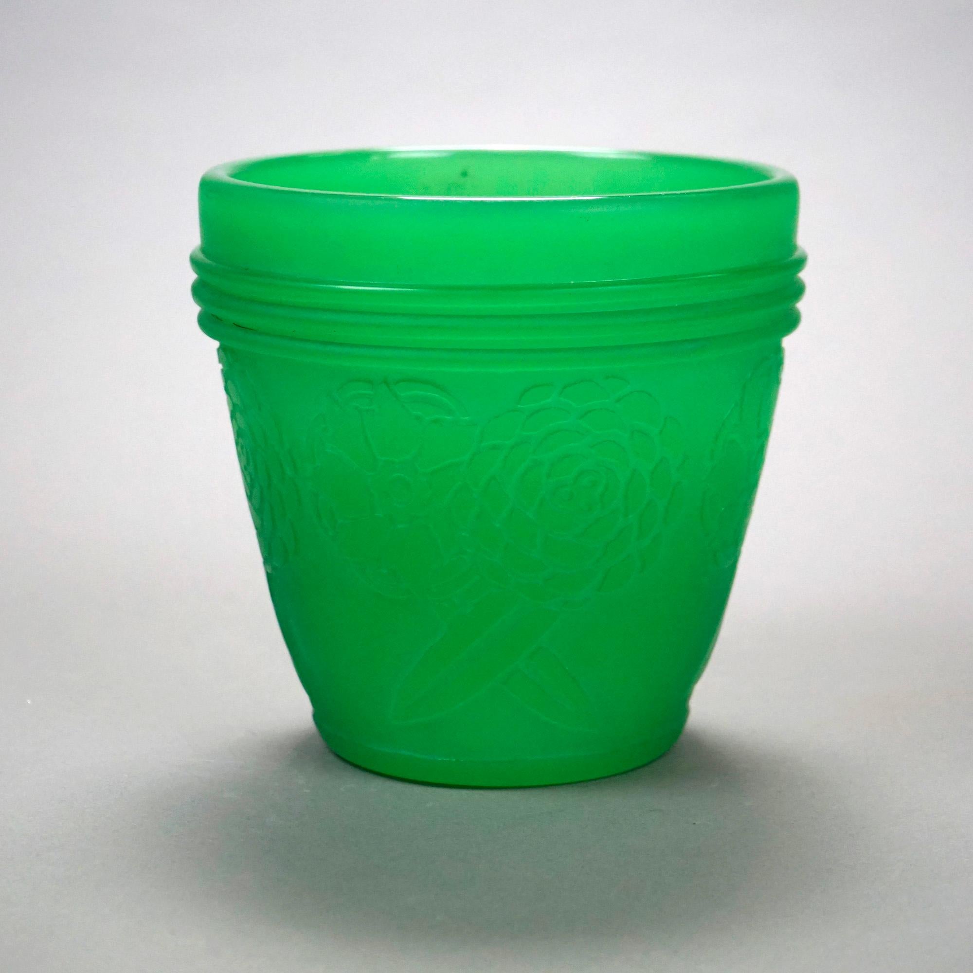 An antique vase or small pot by Steuben offers jade green art glass construction with cutback design of flowers, c1930

Measures- 6.25''H x 6.5''W x 6.5''D

Catalogue Note: Ask about DISCOUNTED DELIVERY RATES available to most regions within 1,500