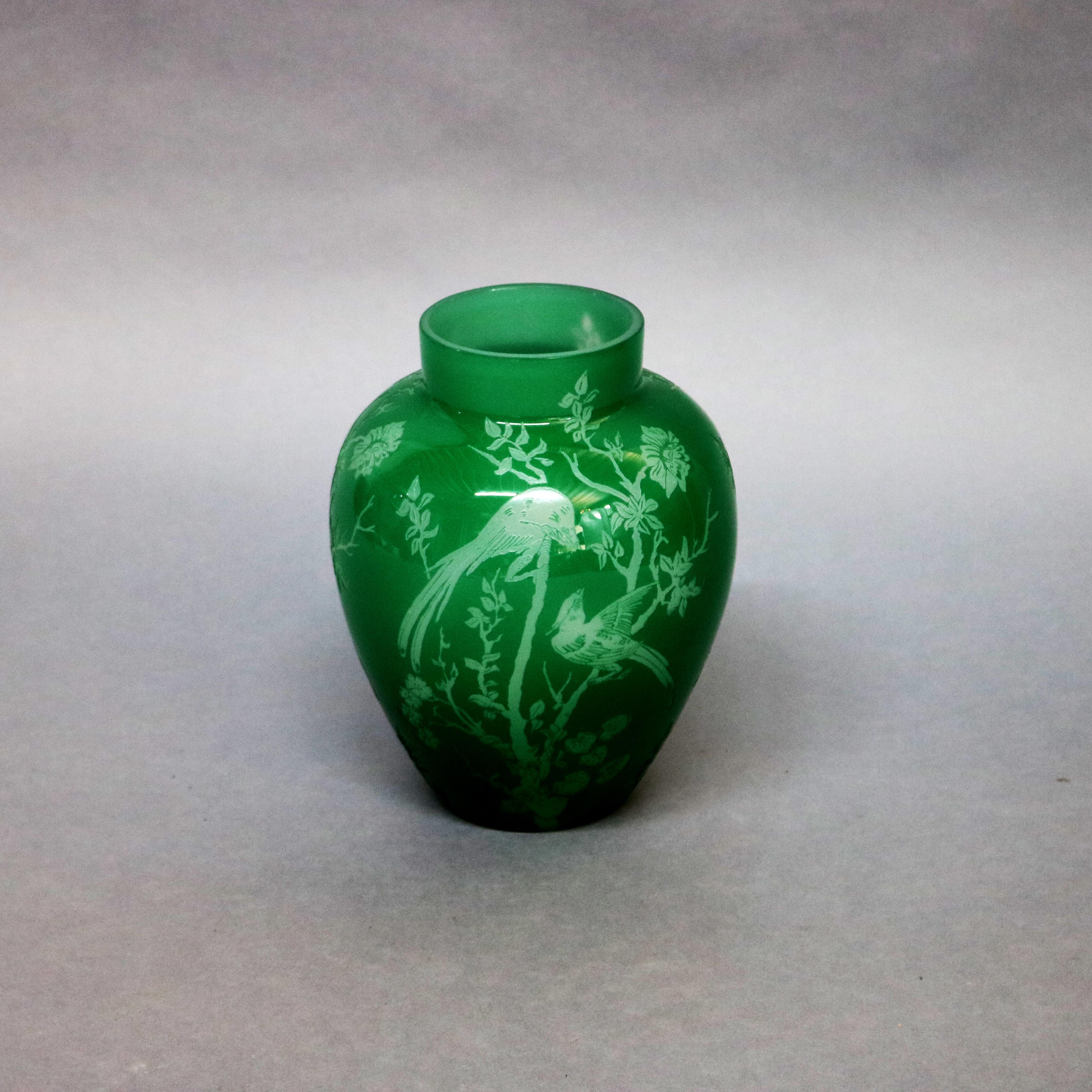 Steuben art glass vase features jade green over alabaster cutback in the Bird of Paradise pattern, circa 1930

Measures: 9