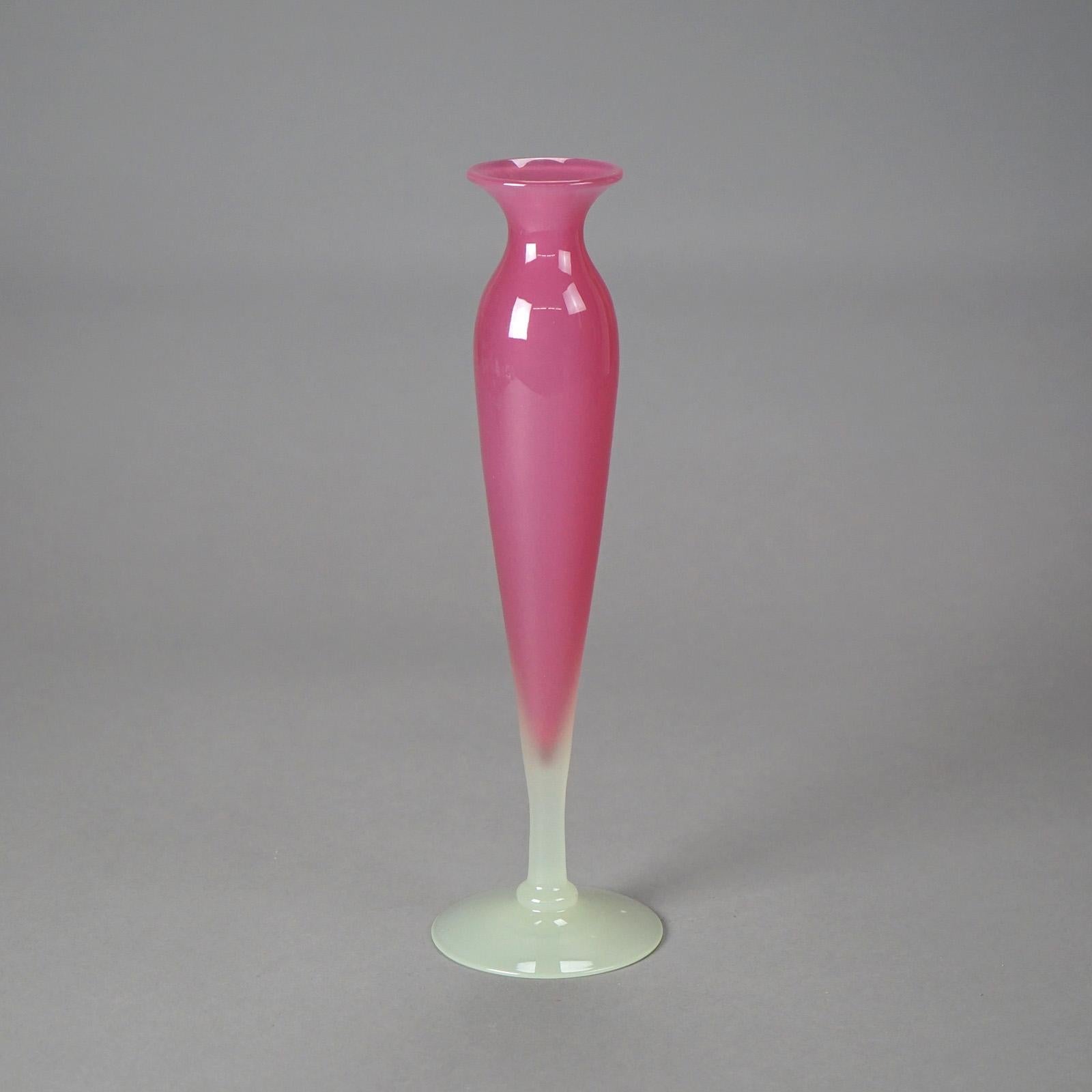An antique Steuben footed bud vase offers Rosaline Pink and Alabaster art glass construction, c1920

Measures - 12.25