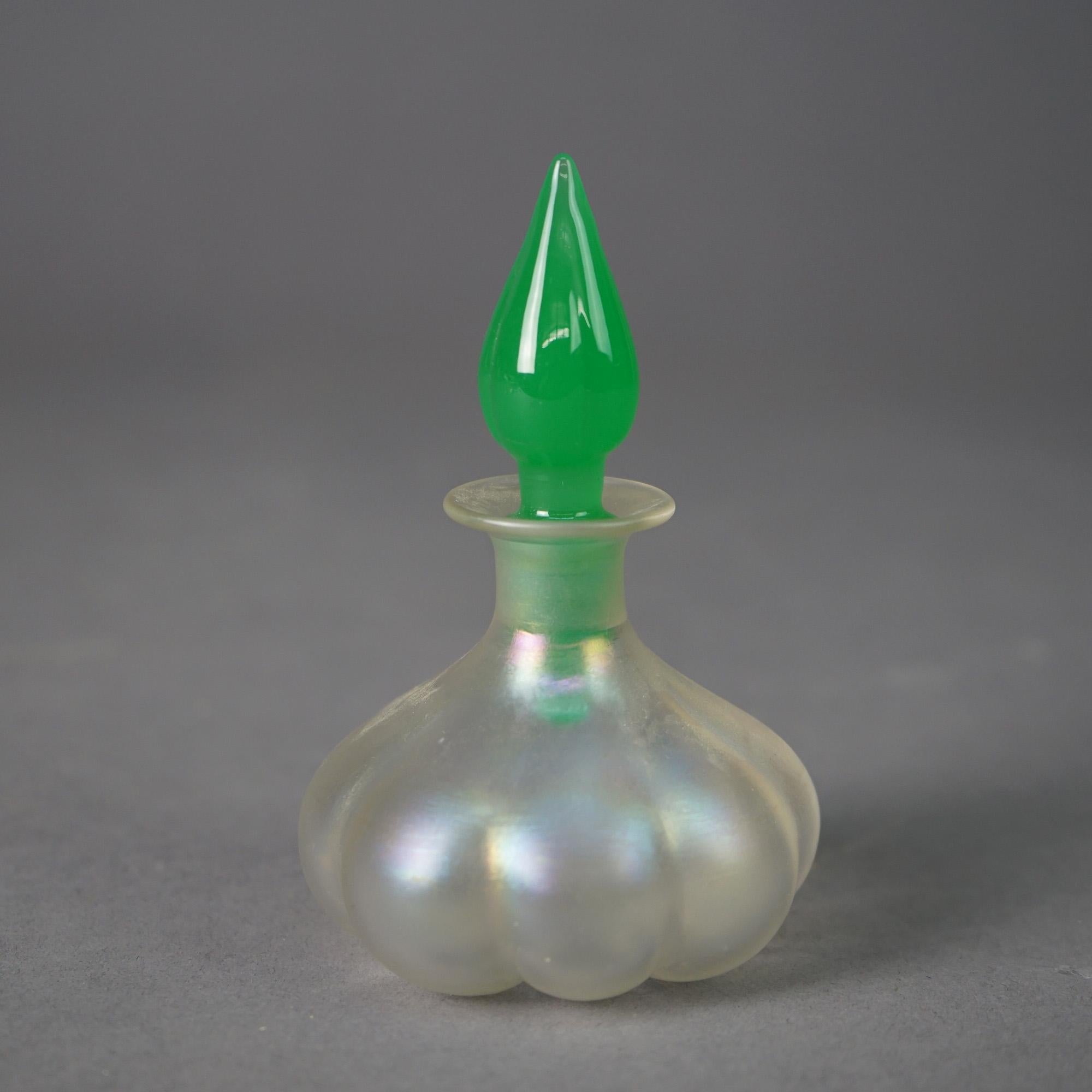 An antique Steuben Verre De Soie perfume bottle offers mellon form with jade jade stopper in stylized flame form, c1930

Measures - 4.5