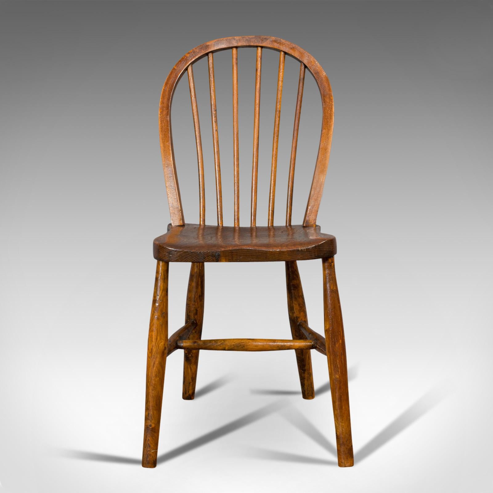 This is an antique stick back chair. An English, elm and beech station seat, dating to the Victorian period, circa 1870.

Charming Victorian seat with wonderful figuring
Displays a desirable aged patina
Select elm and beech show fine grain