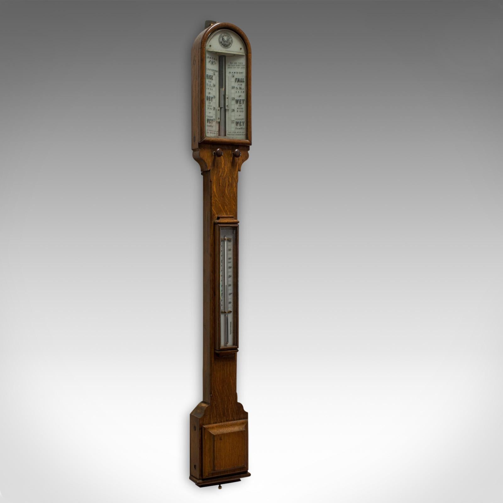This is an antique stick barometer. An English, oak twin vernier barometer from the Army and Navy Co-operative Society and dating to the Victorian period, circa 1900.

Select oak displays rich caramel hues and a desirable aged patina
Original
