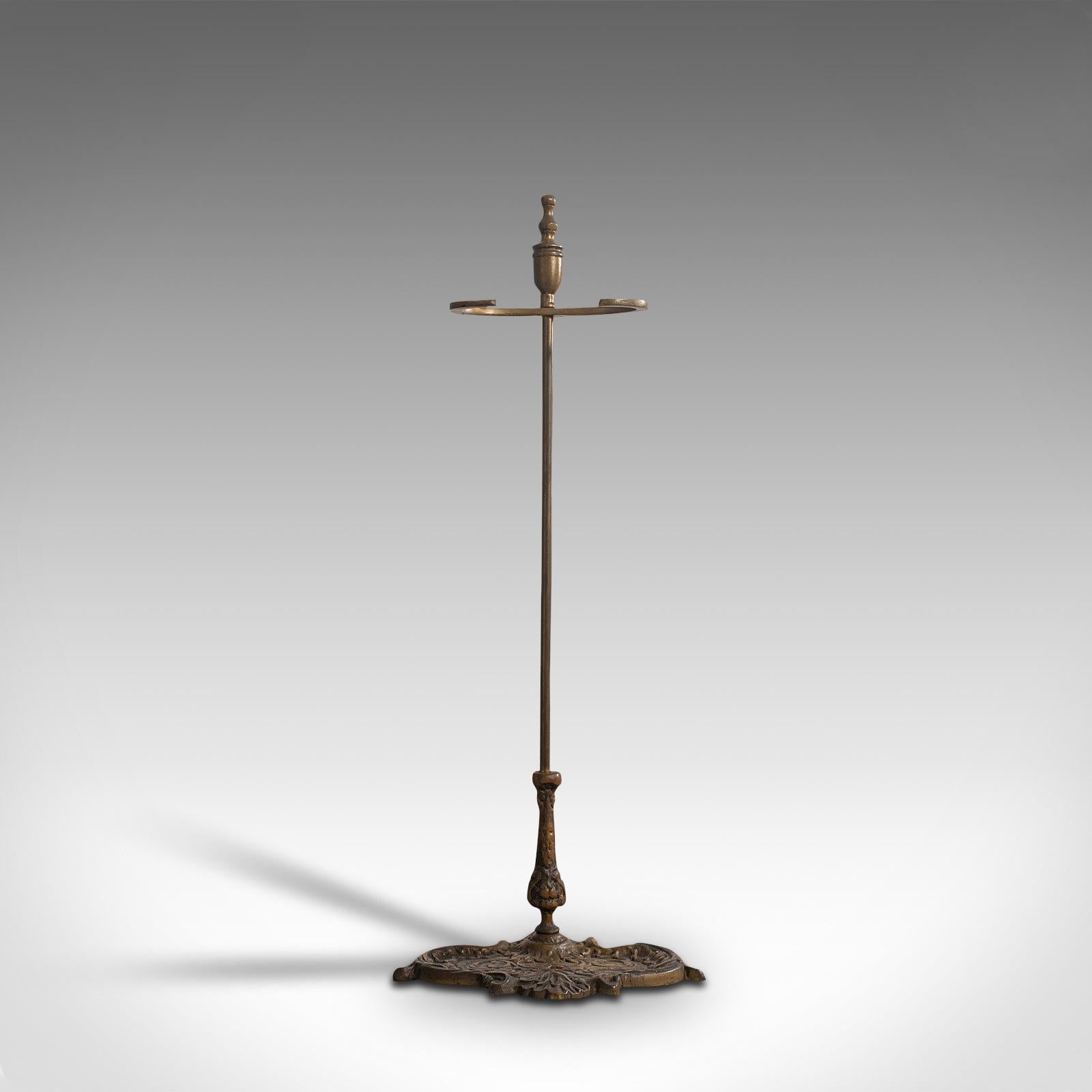 This is an antique stick stand. A French, brass hallway cane or umbrella rack, dating to the late Art Nouveau period, circa 1920.

Elaborate early 20th century French taste
Displaying a desirable aged patina
Weathered brass shows appealing