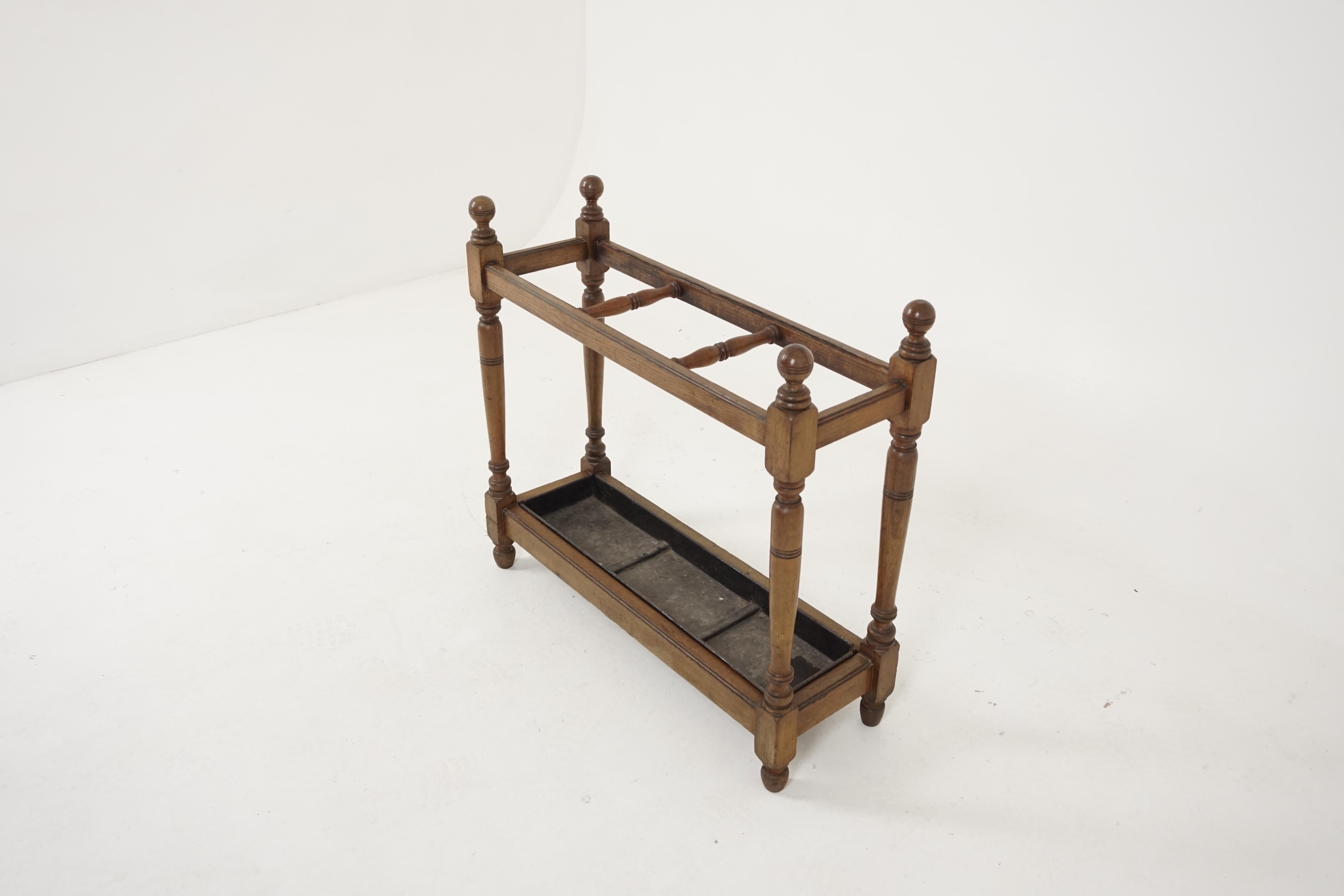 Antique stick stand, Victorian oak umbrella stand, antique furniture, Scotland 1895, B1897

Scotland 1895
Solid oak
Original finish
The stand has four turned supports
Two divisions to hold the umbrellas or sticks
Removable metal drip