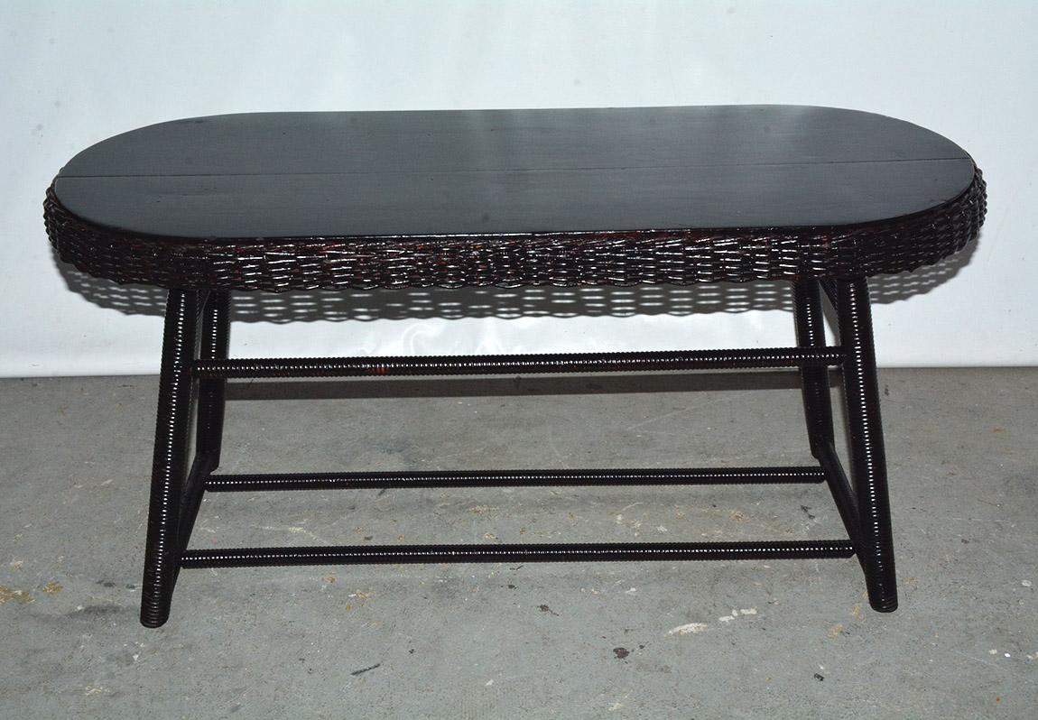Antique American Art Deco style split reed stick wicker coffee or cocktail table. Woven of willow, newly painted in black. Great for the porch or patio.
Search terms: rattan.