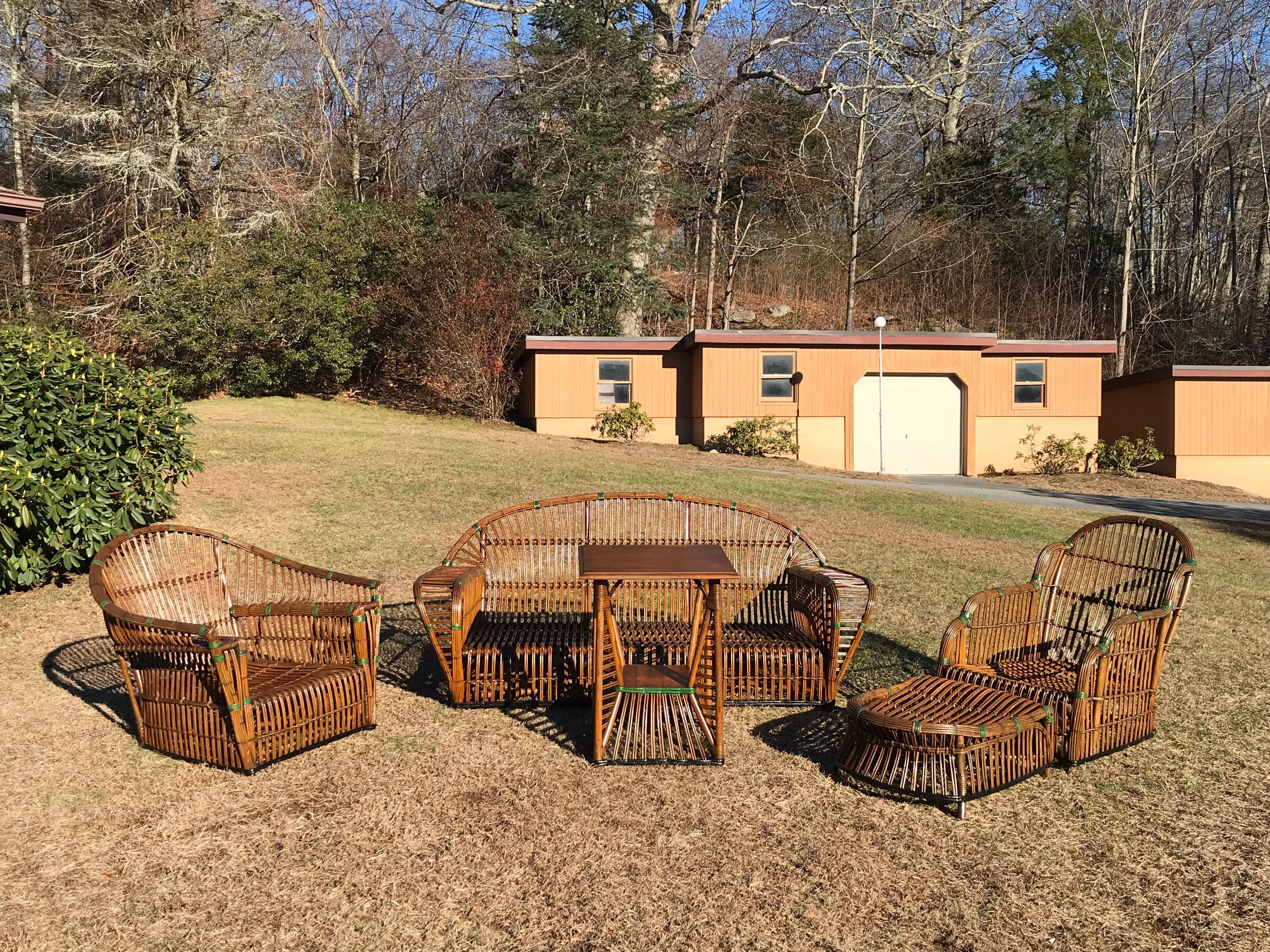 American stick rattan set handcrafted in the 1930s. Set retains its original natural finish and beautiful aged color. Table top shows use appropriate for its age.
Sofa 73