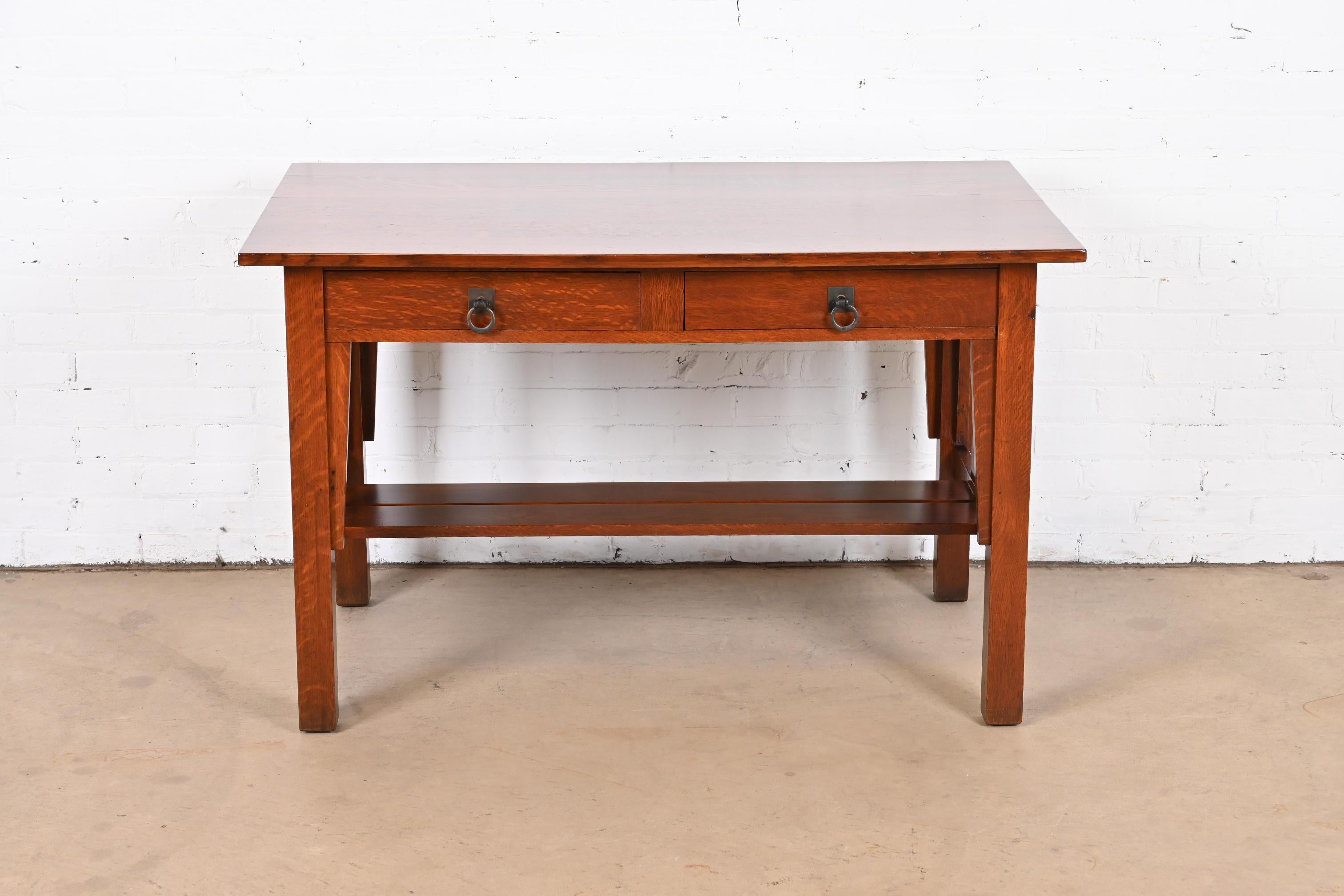 An exceptional antique Mission or Arts & Crafts writing desk or library table

By Stickley Brothers

USA, Circa 1900

Quarter sawn oak, with original hammered copper hardware.

Measures: 48