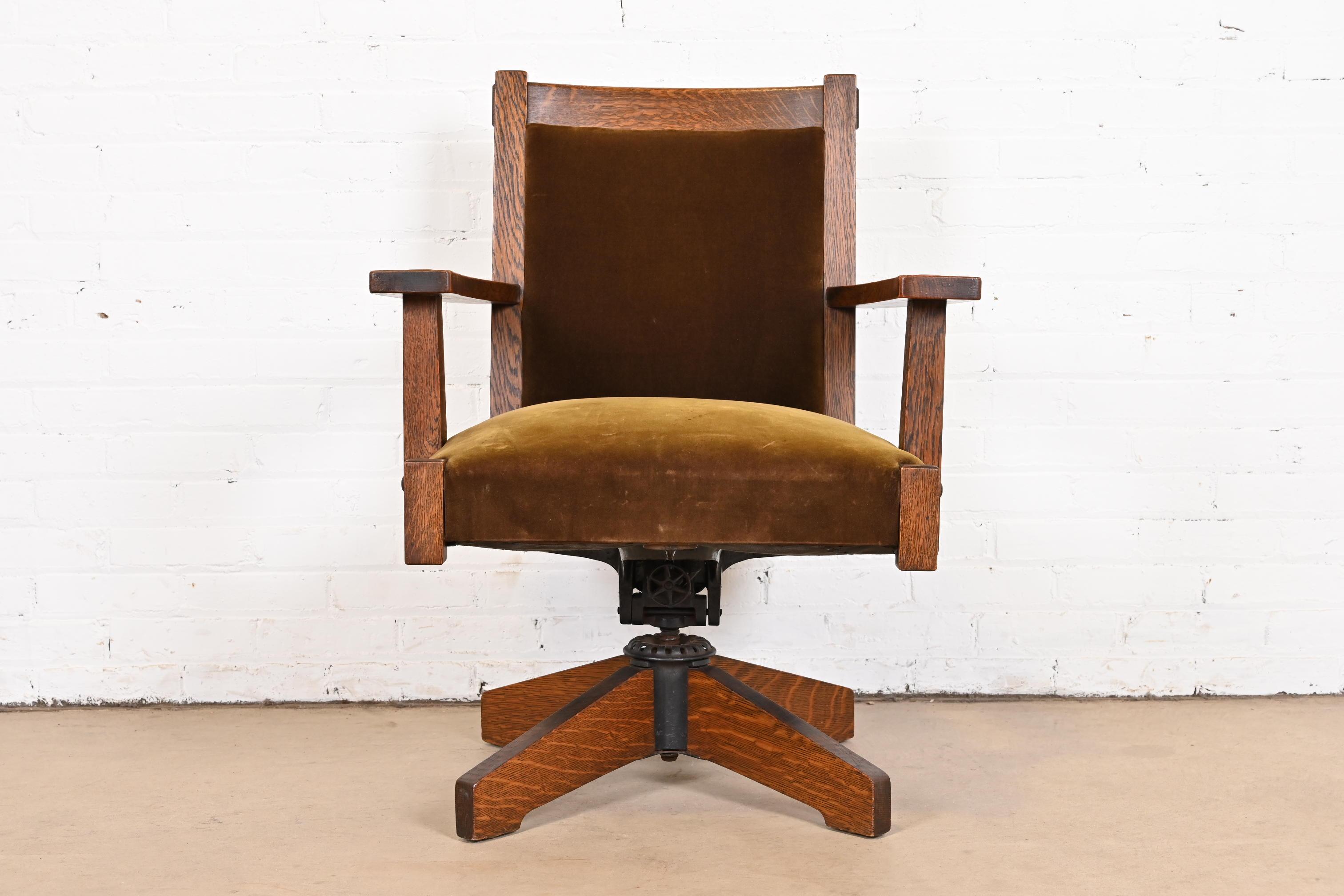 A rare and exceptional Mission or Arts & Crafts executive swivel desk chair

By Stickley Brothers

USA, circa 1900

Solid quarter sawn oak and iron frame, with chartreuse velvet upholstery.

Measures: 28
