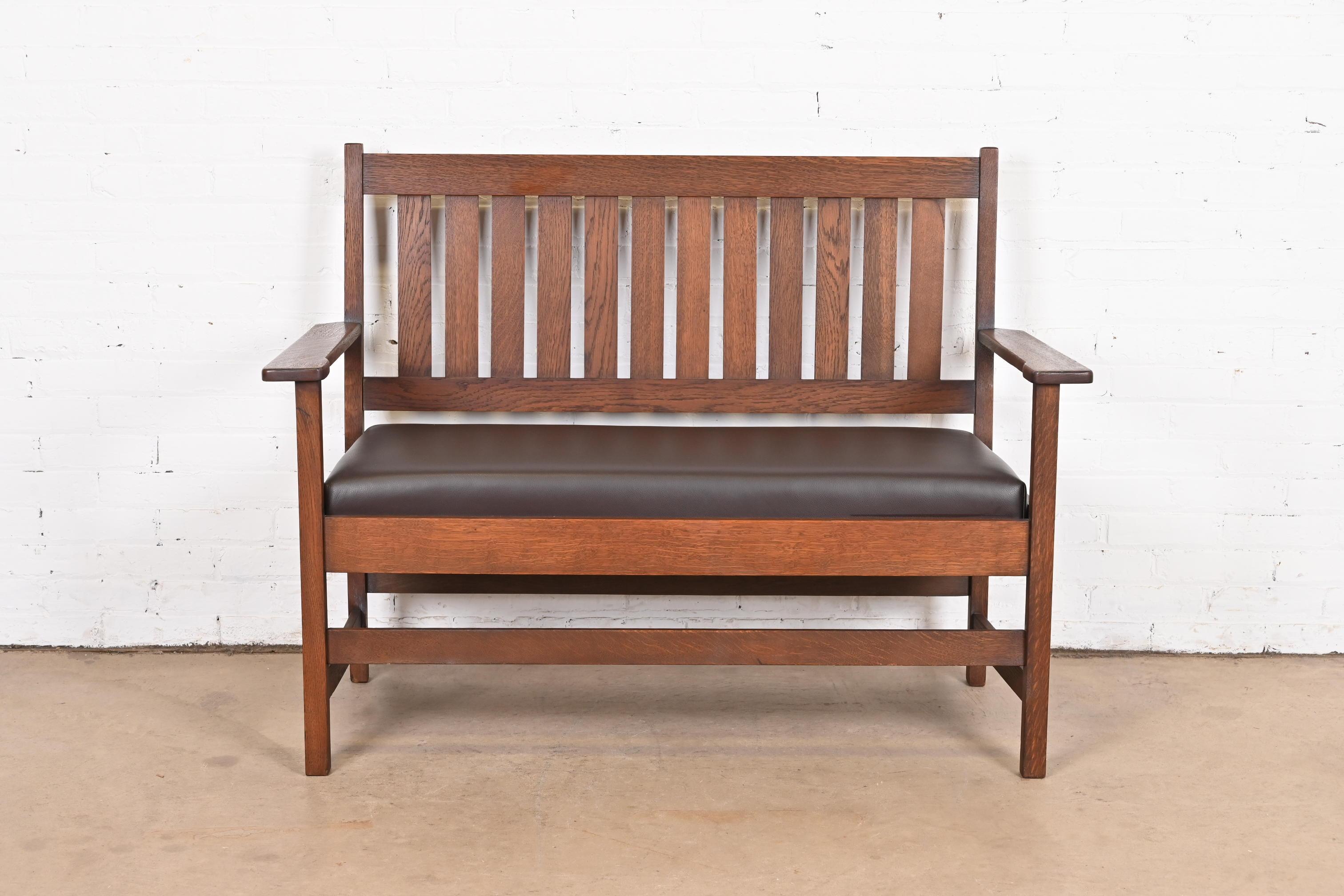 A beautiful Mission or Arts & Crafts loveseat, settee, or bench.

By Stickley Brothers

USA, circa 1900.

Solid quarter sawn oak, with newly upholstered brown leather seat cushion.

Measures: 50.75