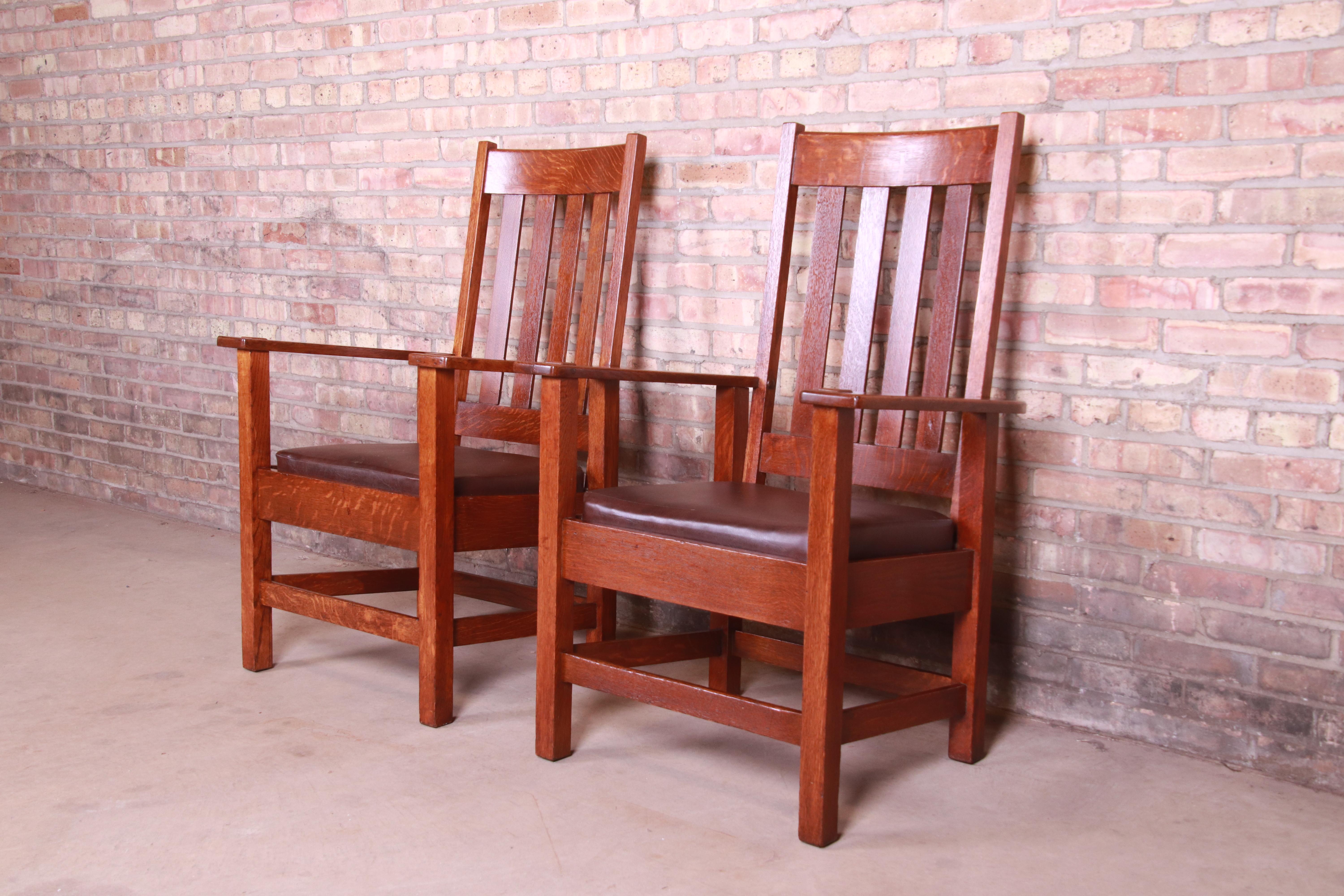 An exceptional pair of antique mission oak Arts & Crafts high back club chairs or lounge chairs

By Stickley Brothers

USA, circa 1900

Solid quarter sawn oak, with brown leather upholstery.

Measures: 27.38