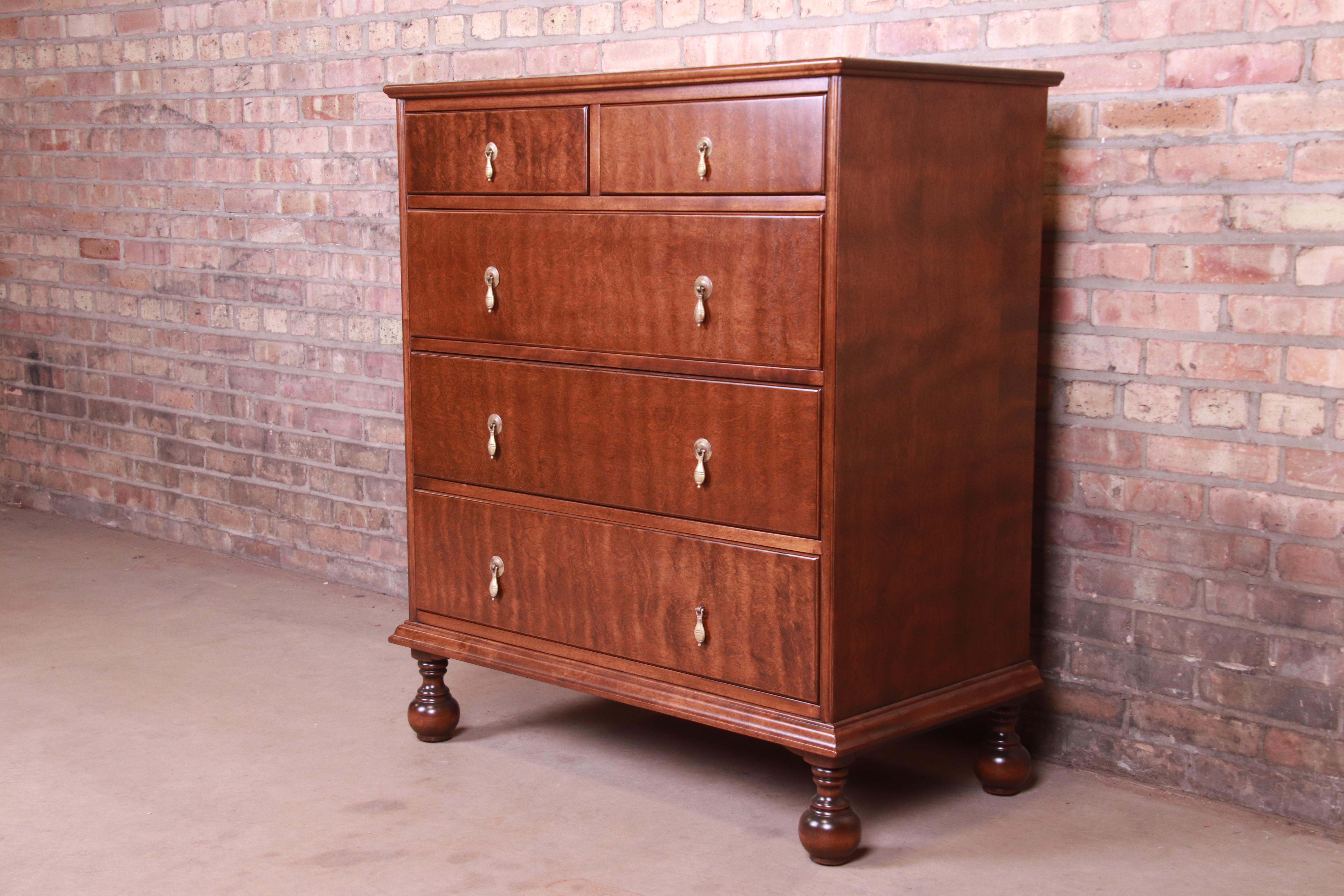 A gorgeous antique William & Mary style five-drawer highboy chest of drawers

By Stickley Brothers

USA, circa 1900

Figured maple, with original brass teardrop hardware.

Measures: 37