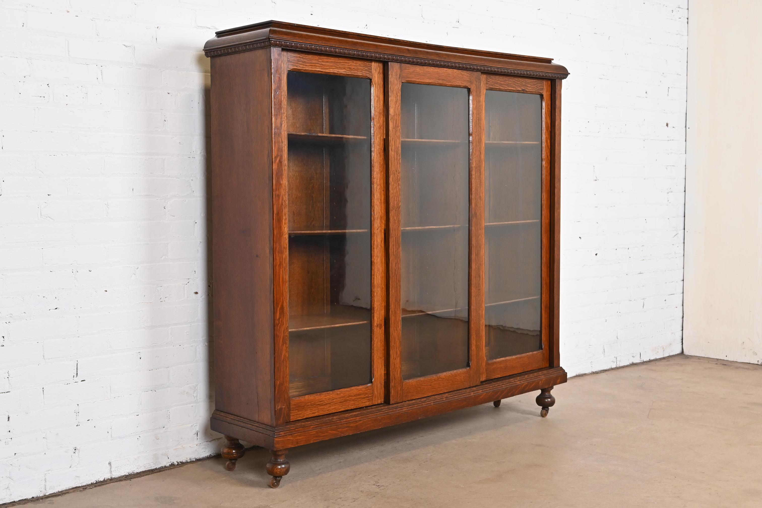 American Antique Stickley Style Arts & Crafts Oak Glass Front Triple Bookcase, circa 1900