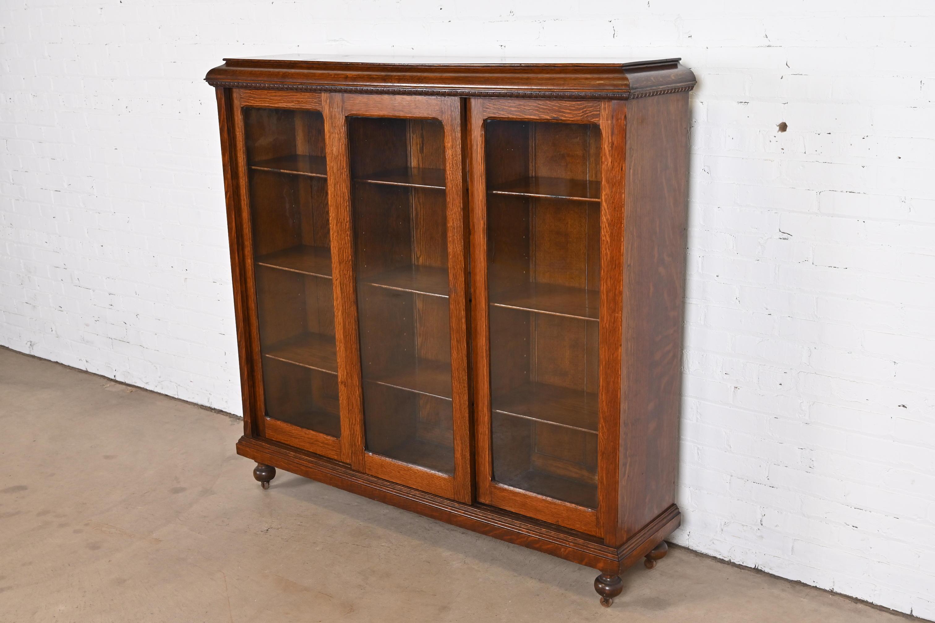 20th Century Antique Stickley Style Arts & Crafts Oak Glass Front Triple Bookcase, circa 1900