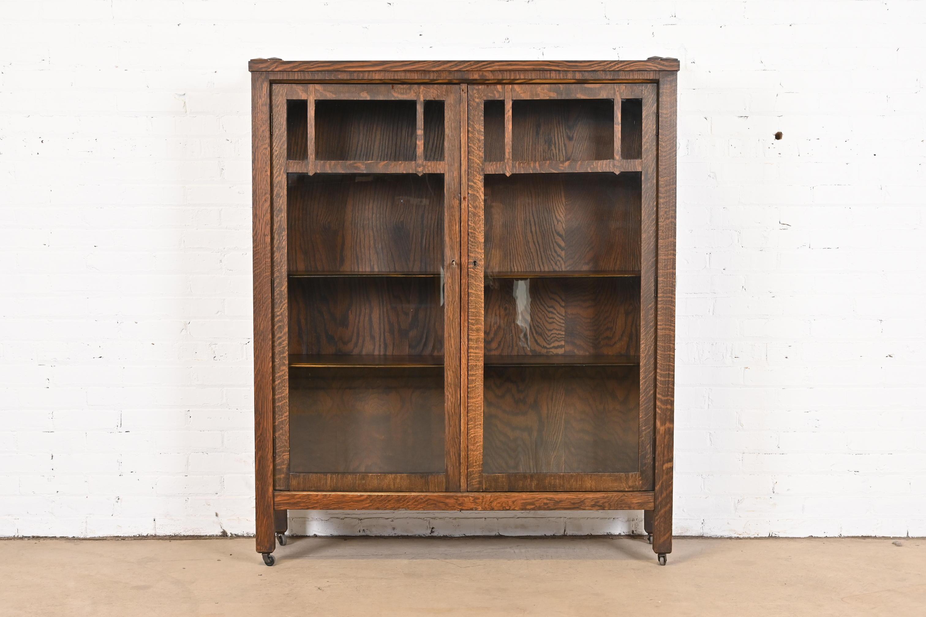 A gorgeous antique Mission or Arts & Crafts double bookcase cabinet

In the manner of Stickley

USA, Circa 1900

Quarter sawn oak, with mullioned glass front doors. Cabinets lock, and key is included.

Measures: 47