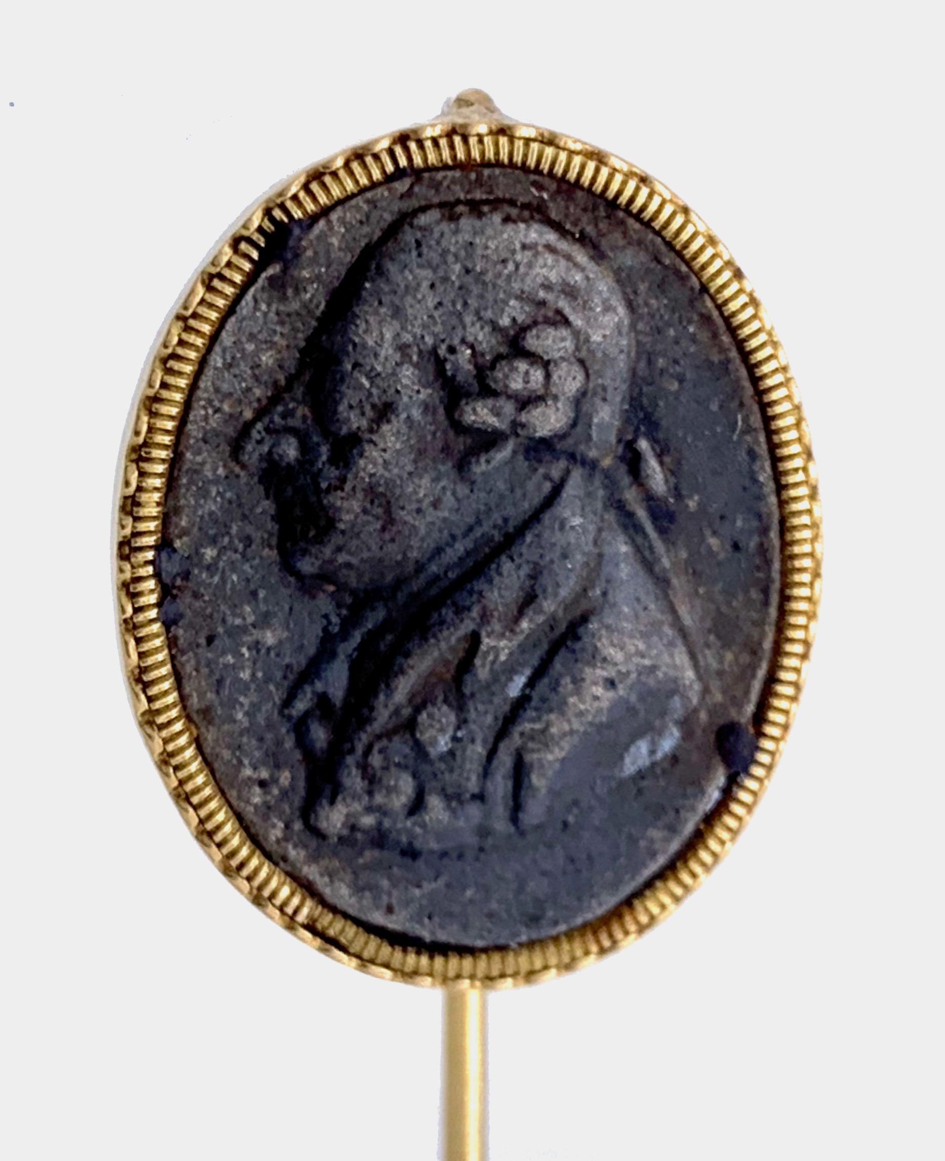 This unusual 14 karat gold stickpin features a cast Berlin Iron portrait in profile of Frederick II. the Great, King of Prussia, in a delicate gold mount made out of 14 karat gold.
A similar Berlin Iron plaque is depicted and described in the