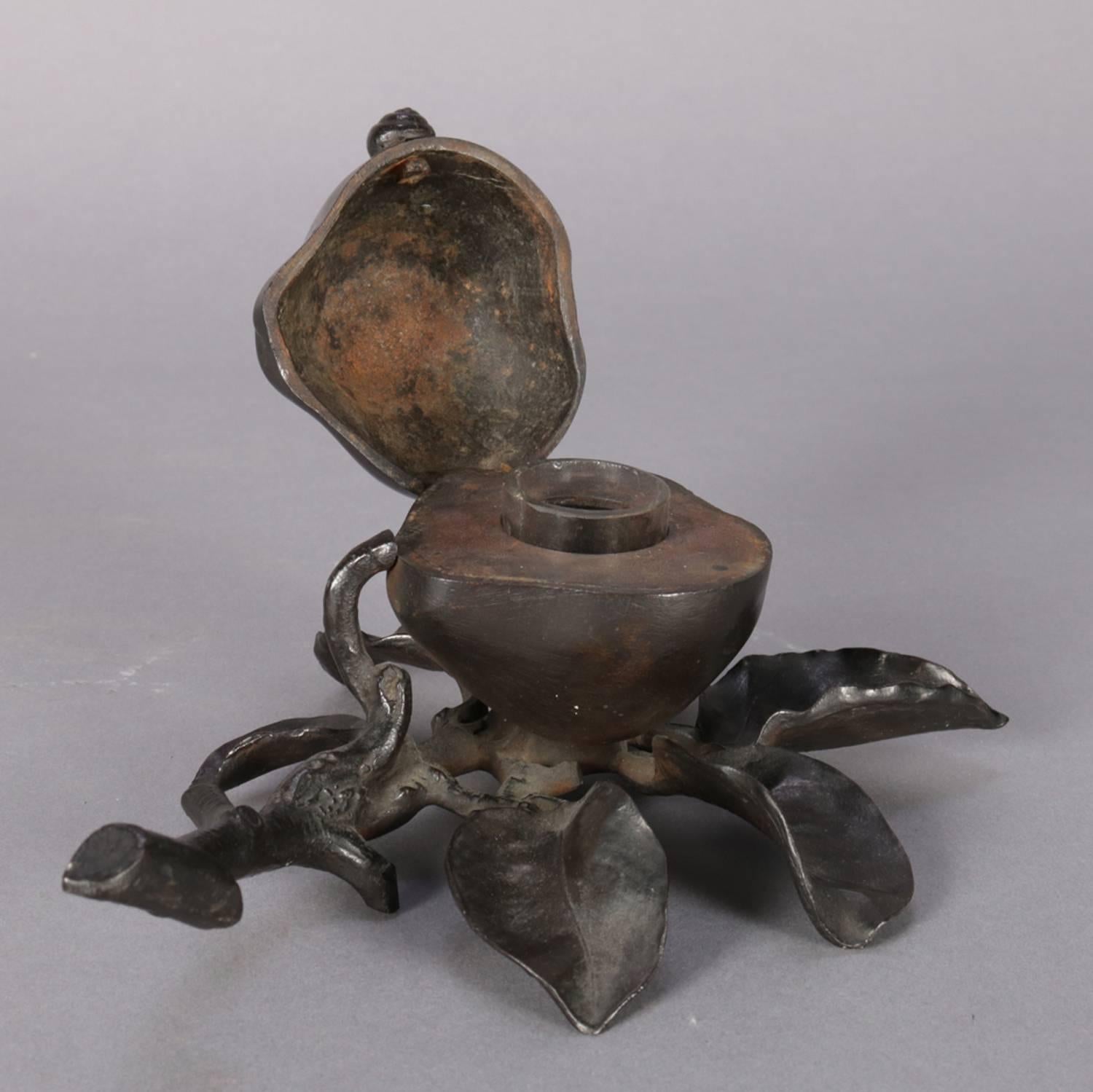 Antique cast metal figural fruit still life sculpture inkwell, pear form case opens with snail form handle to glass insert and is seated on branch and leaf form Stand, 19th century
 
***DELIVERY NOTICE – Due to COVID-19 we are employing NO-CONTACT