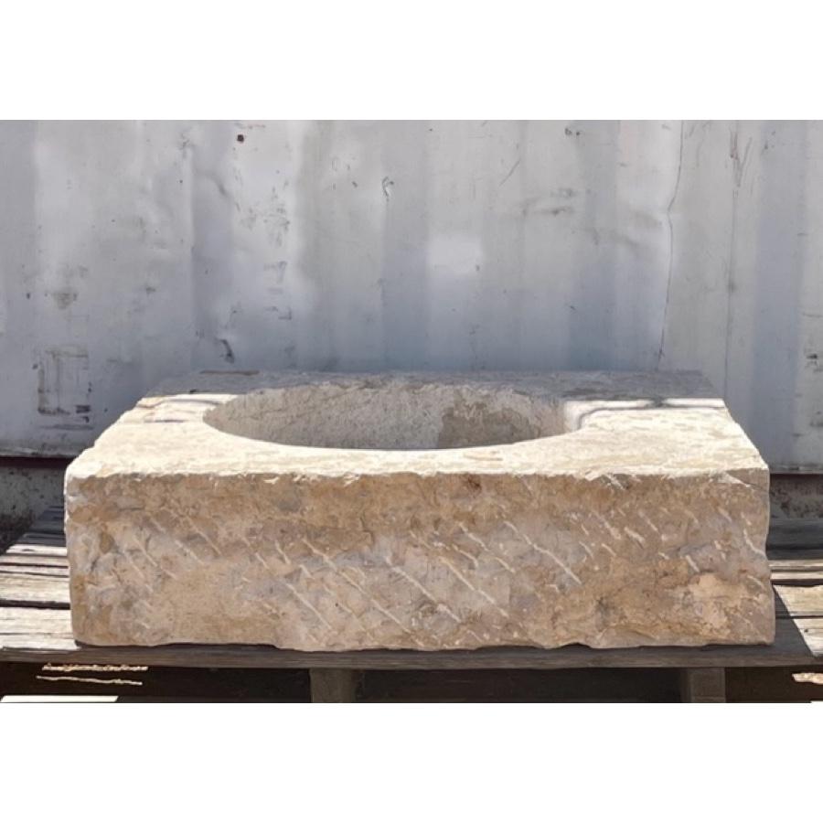 Such a beautiful and simple combination of shapes with this antique basin of hard, French limestone. With a simple round bowl offset in the squarish body, this elegant basin would be a wonderful focal point in a bathroom, outdoor kitchen or garden.