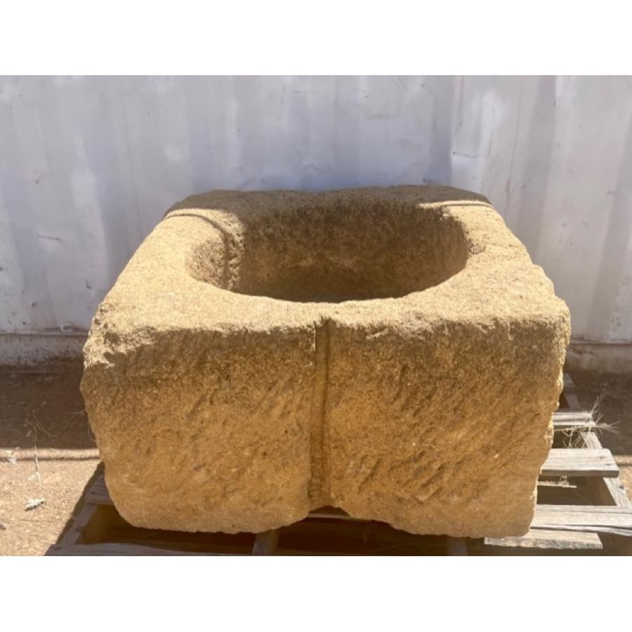 Warm colored reclaimed antique stone basin, square shape with textured sides and round center basin. This stone piece would make a great planter or fountain.