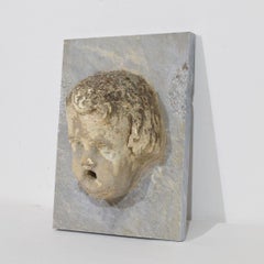 Antique Stone Cherub Fountain Head on Marble Panel, Italy, Circa 1650-1750