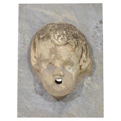 Antique Stone Cherub Fountain Head on Marble Panel, Italy, Circa 1650-1750