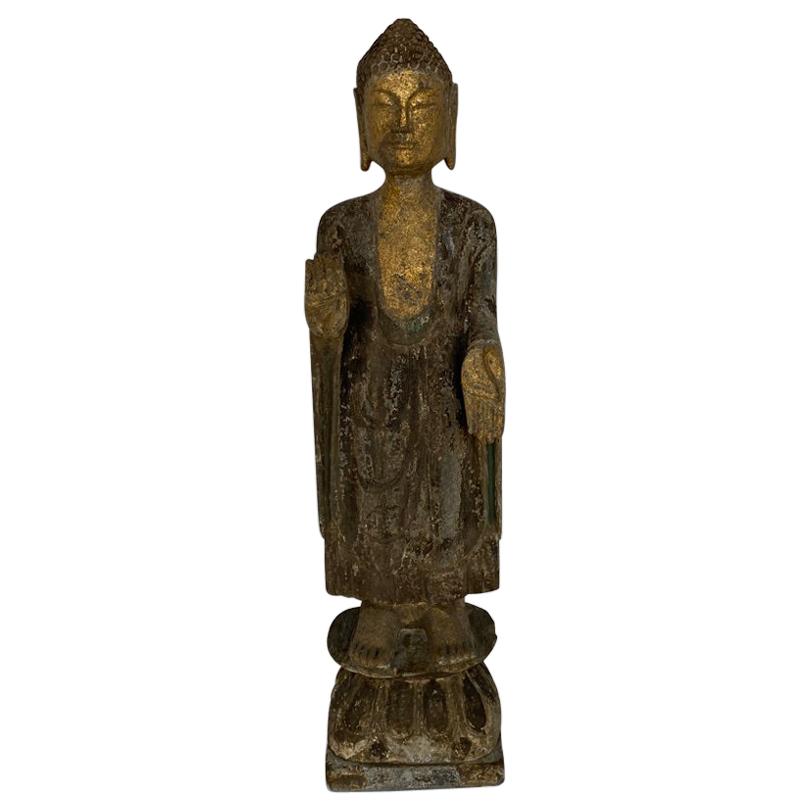 This handcrafted from stone is a column Buddha hands in the position of
