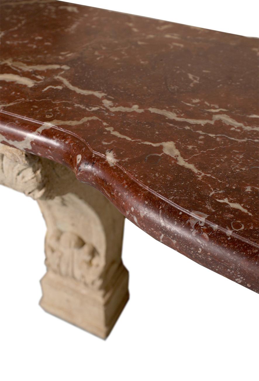 French stone console with red marble top in the style of Louis XIV, featuring legs carved out of a solid piece of limestone.

Please note: due to the heavy weight, the console is not free standing, so it needs to be wall fixed. Suitable for outdoor.