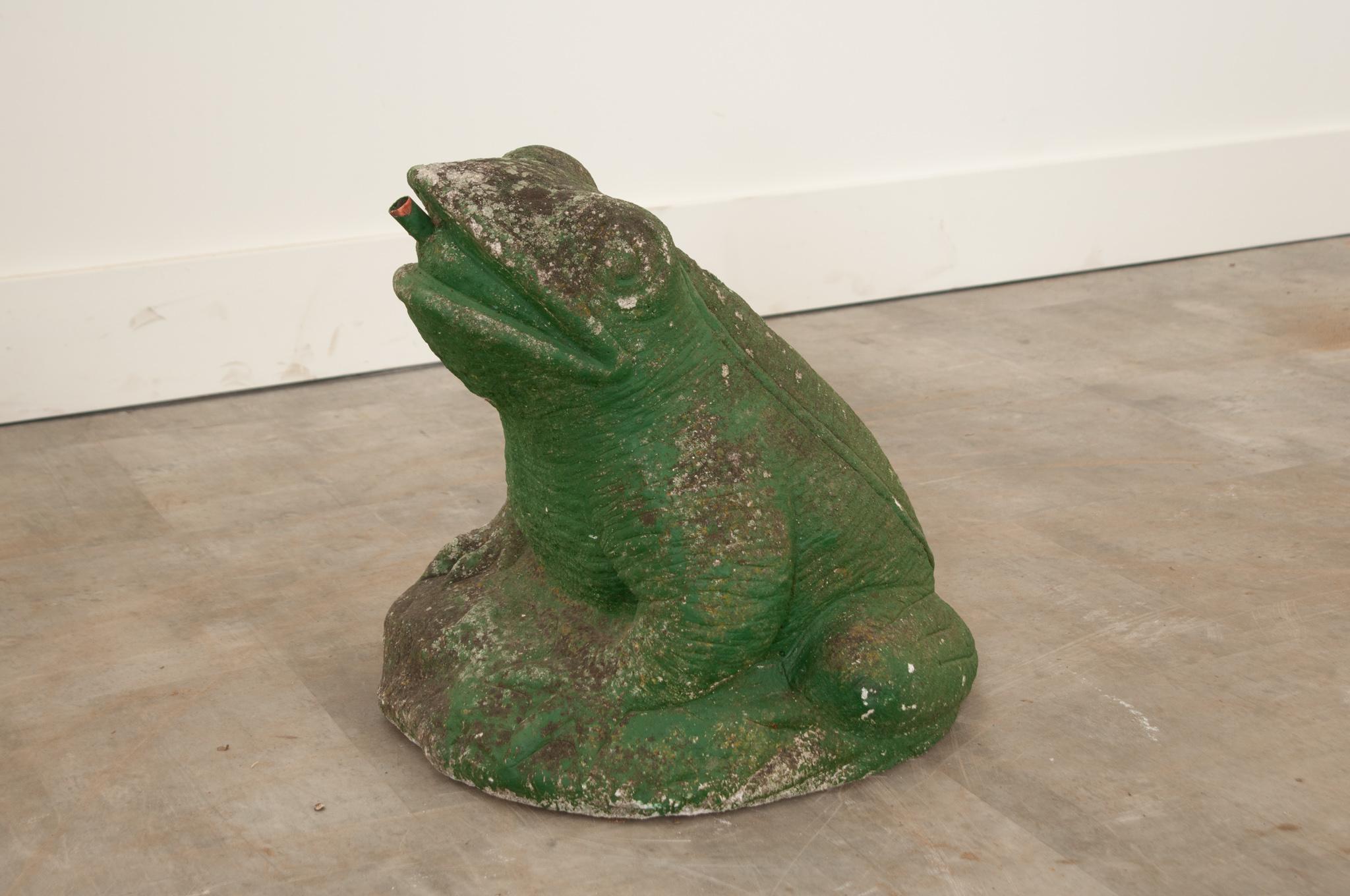 This darling green painted stone frog is the perfect way to liven up any garden. Ripples in the skin and ridges along the back give it a wonderfully realist texture. Still in working condition as a fountain. Make sure to view the detailed images to
