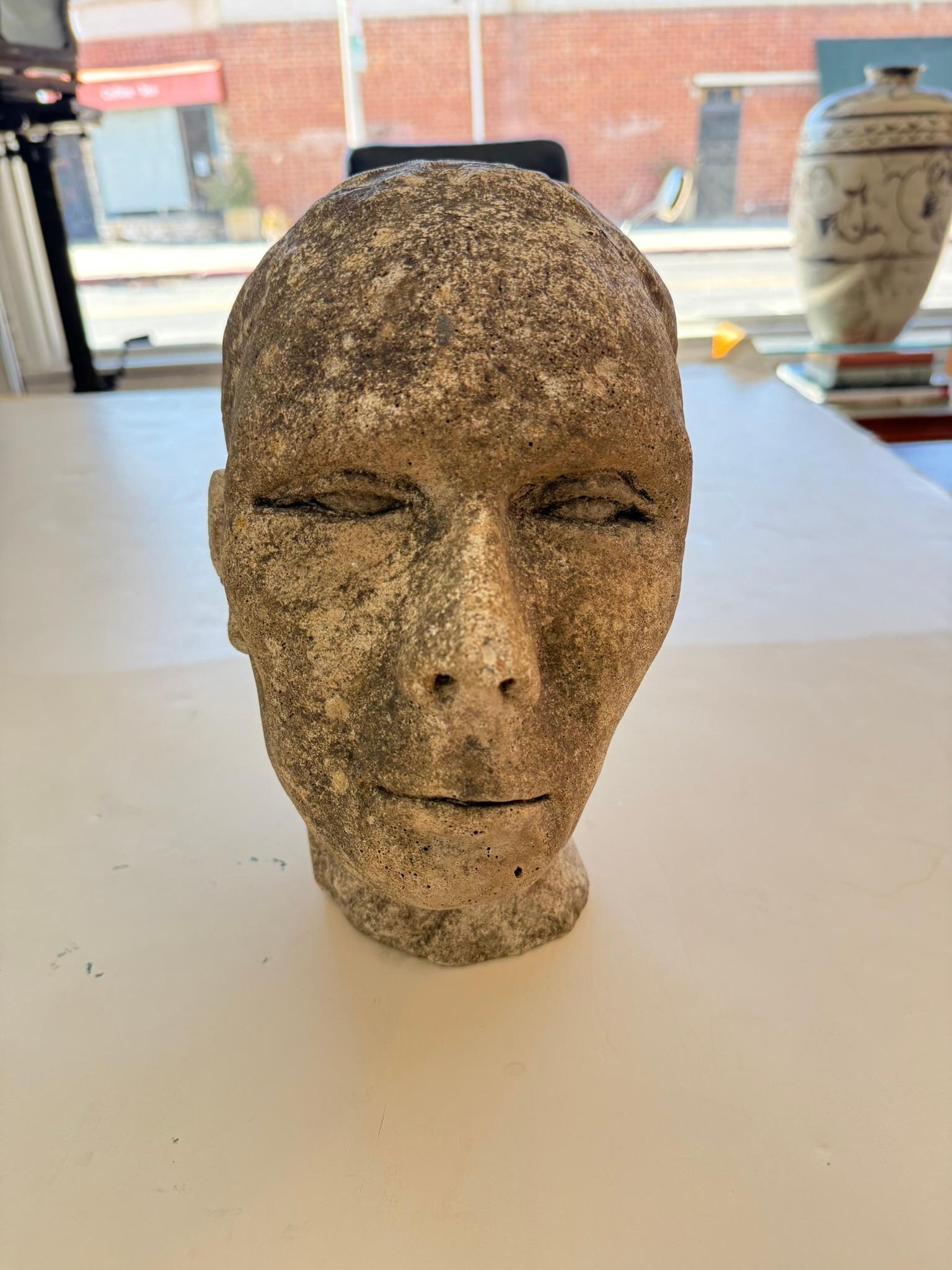 Solid stone, antique head of a young man. Very unique decorative piece.