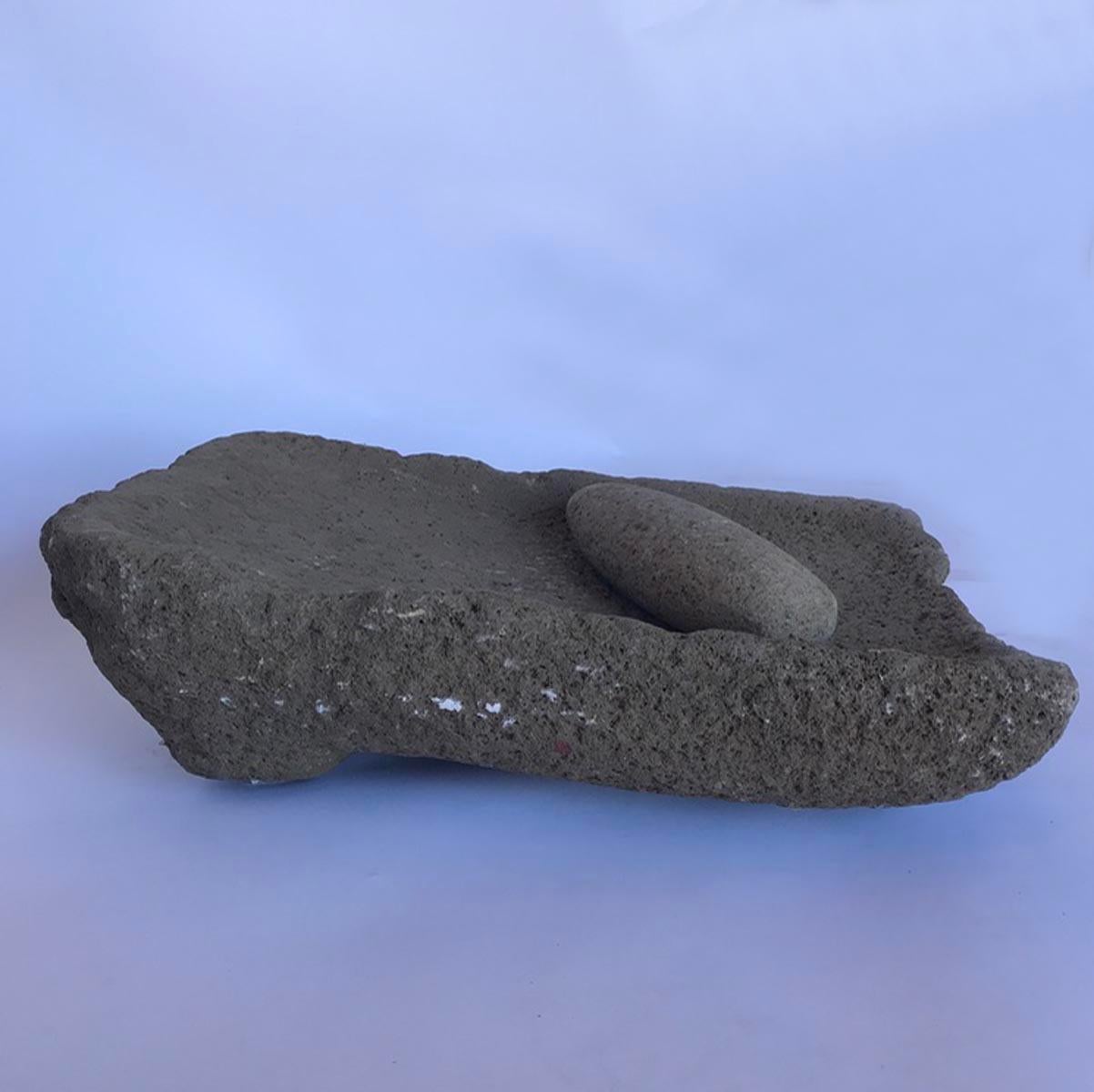 Early 20th century Guatemalan stone matate, or piedra de moler - grinding stone. Carved from one piece of stone, usually volcanic rock. Used for grinding corn and seeds. Comes with the grinder.