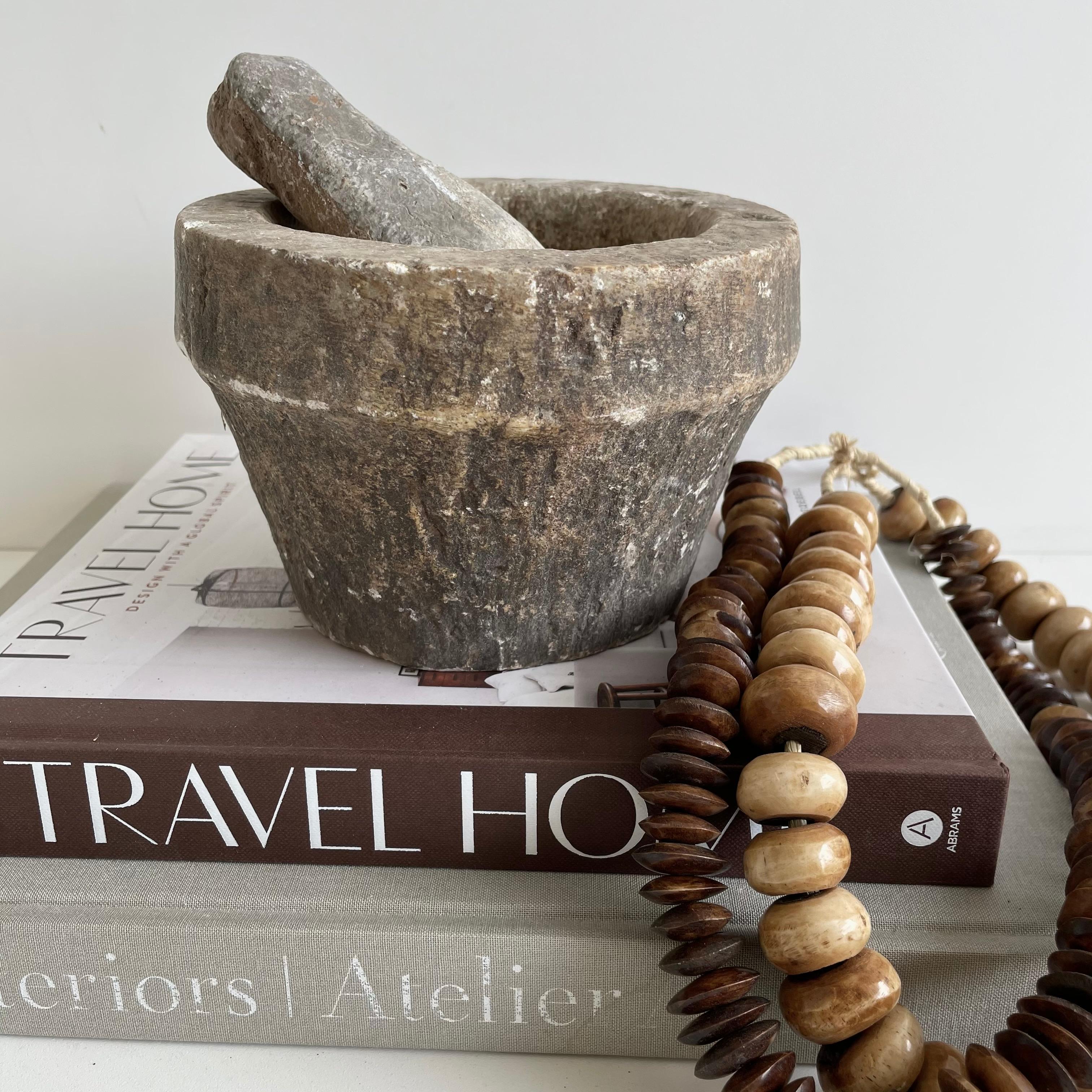 Antique stone mortar and pestle bowl set.

Antique stone mortar and pestle bowl set, great decorative item, or can be used.
Accessories not included
Size: 6.5 x 6.5 x 5.