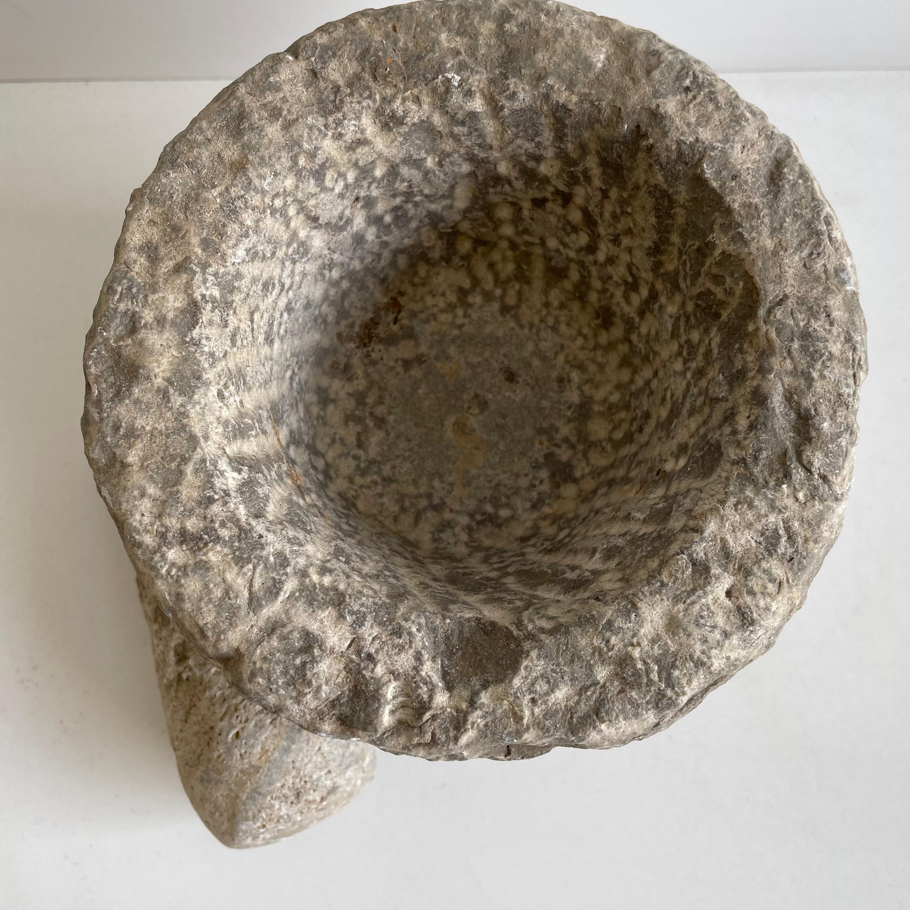 Antique stone mortar and pestle bowl set

Antique stone mortar and pestle bowl set, great decorative item, or can be used.
Accessories not included
Size: 6 x 6 x 4.