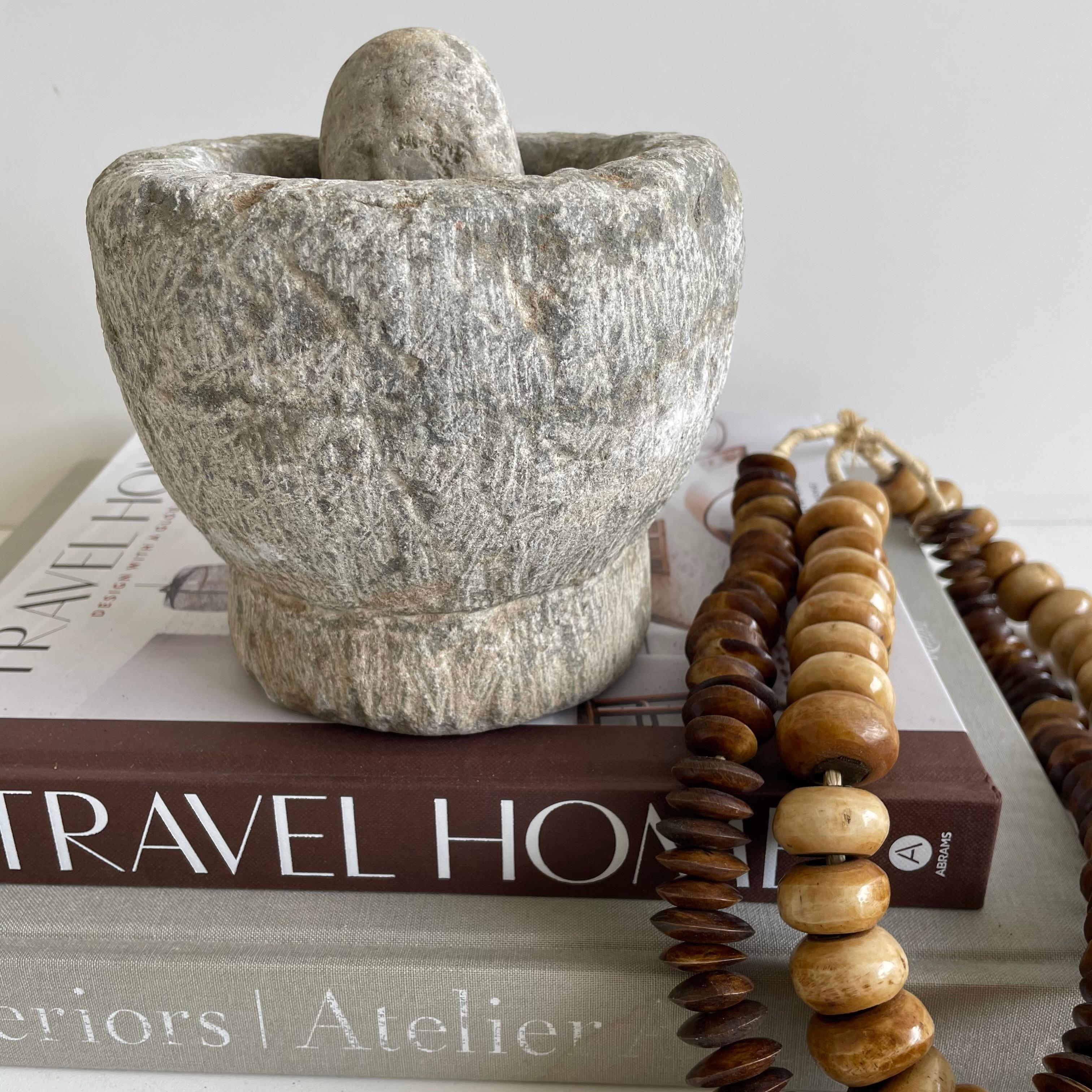 Antique stone mortar and pestle bowl set

Antique stone mortar and pestle bowl set, great decorative item, or can be used.
Accessories not included
Size: 6 x 6 x 5.