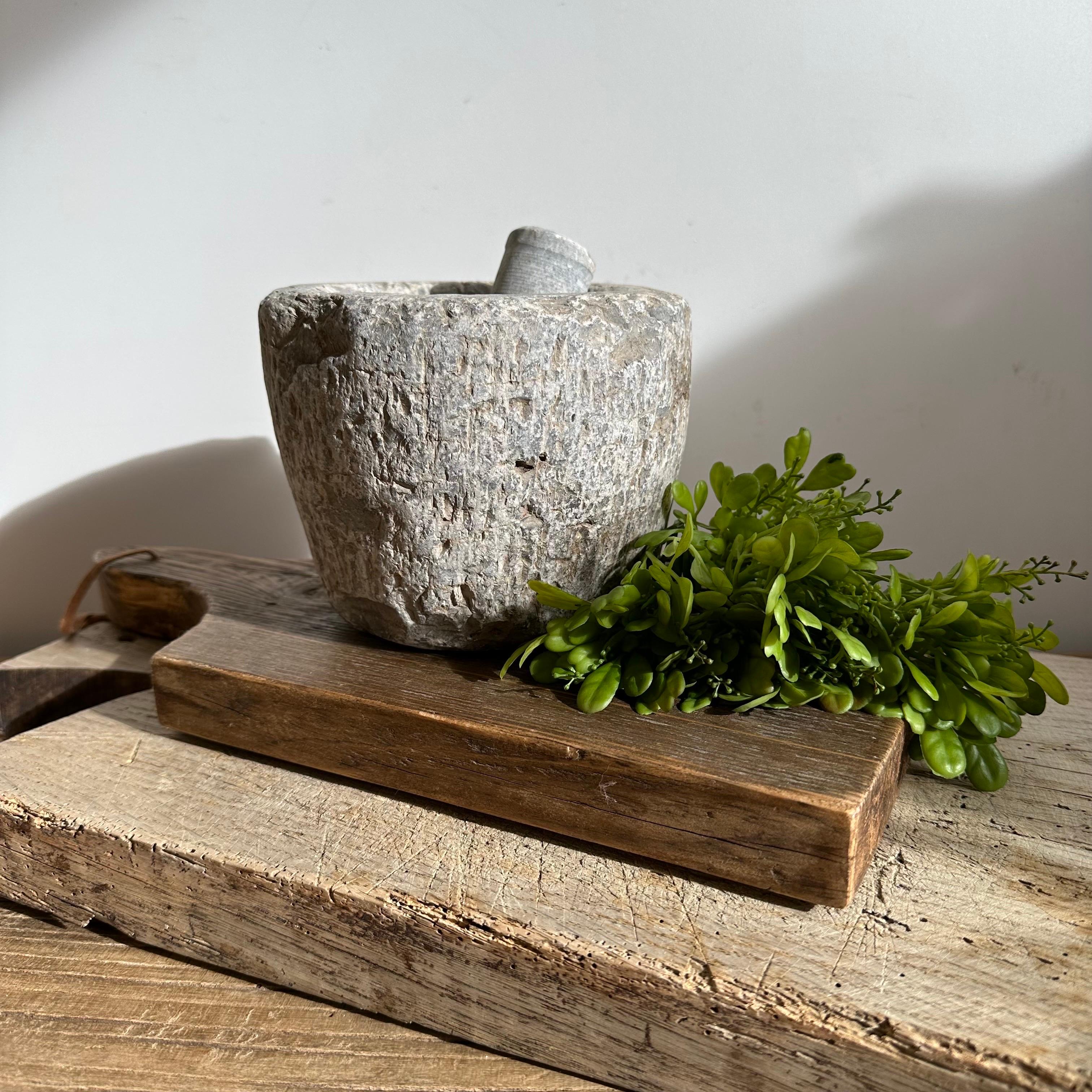 Antique stone mortar bowl and pestle set, great decorative item, or can be used. Accessories not included 
Size: 6.5”d x 5” h.