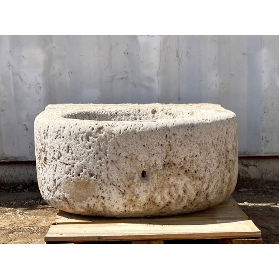 This antique round French basin is made of a hard limestone and is larger in size. It has wonderful character on the surface with weathered dimpling. If you desire a smoother finish on the interior, consider lining it with small mosaic tiles to