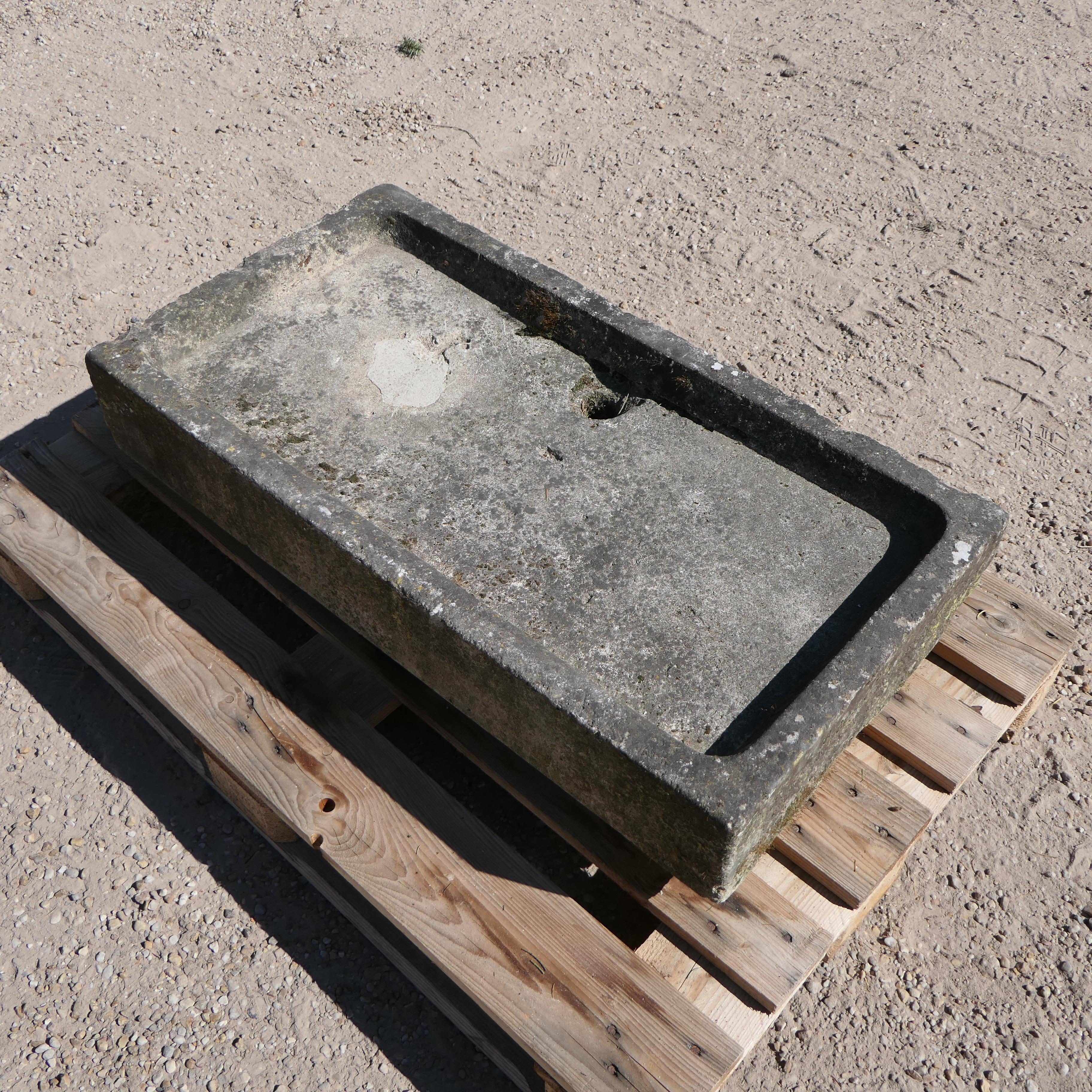 This antique stone sink brings timeless character and rustic charm to any interior or garden setting. Hand-carved from solid stone, its weathered patina and natural imperfections speak to its history and craftsmanship. Ideal for use in a farmhouse