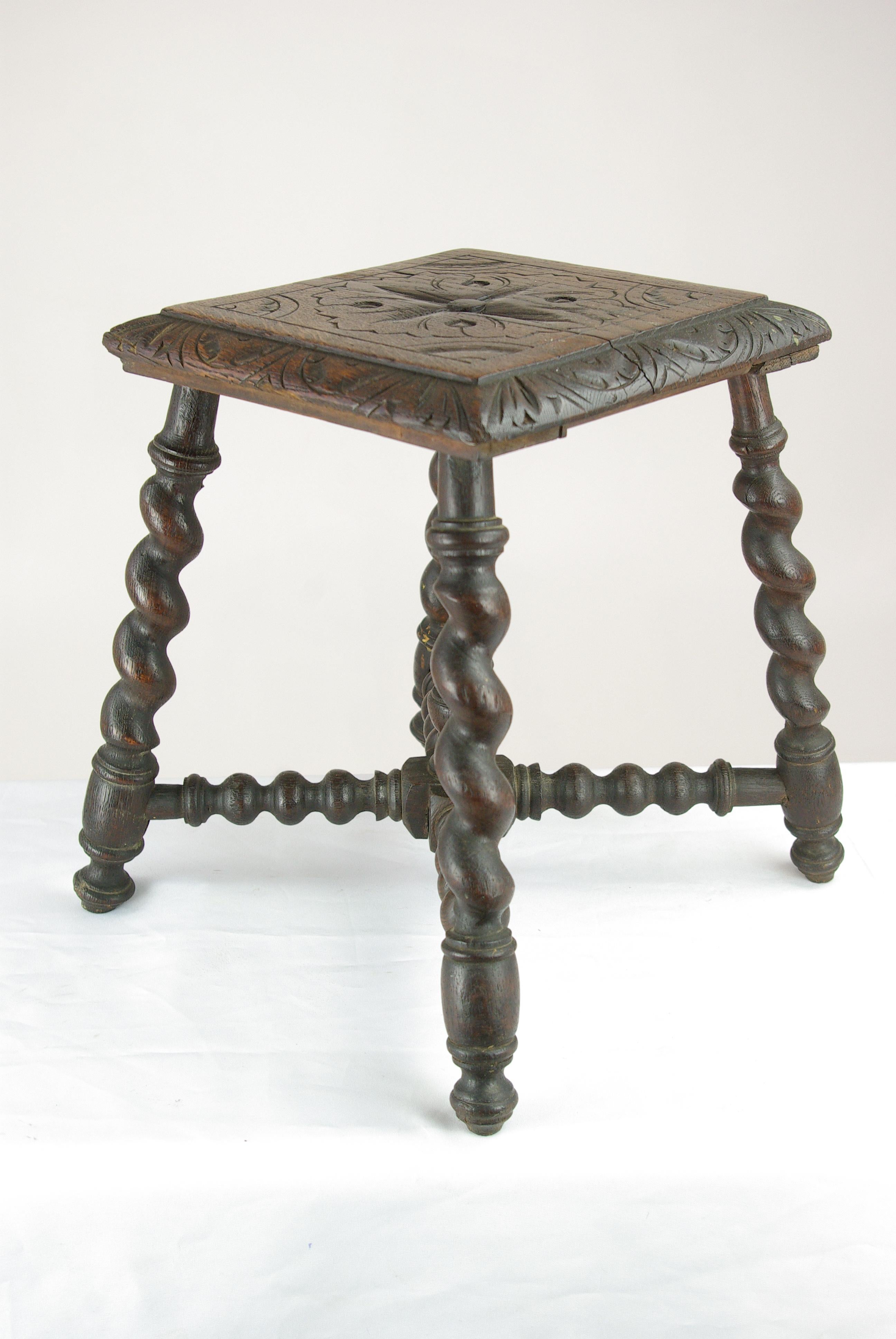 Antique stool, antique Victorian carved oak stool Barley twist stool, Antique Furniture, B1470.

Scotland, 1870s
Solid oak construction
Original dark oak finish
Thick beveled edge carved seat
Supported by four barley twist legs
Connected by