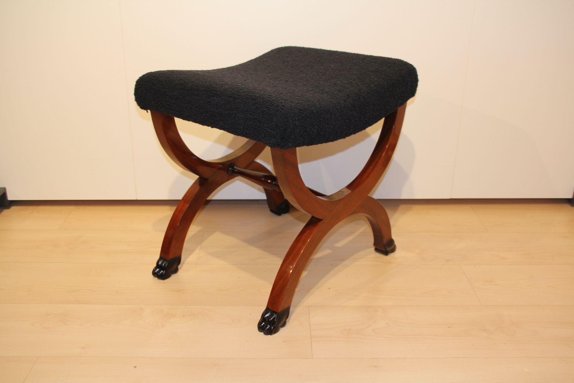 Large antique stool in Mahogany with Paw Feet from the mid 19th century.
Mahogany solid wood. Four ebonized carved paw feet. Restored, hand polished with shellac.
Newly upholstered with black 'teddy' boucle fabric.

Dimensions: 
H 53 cm x W 55 cm x