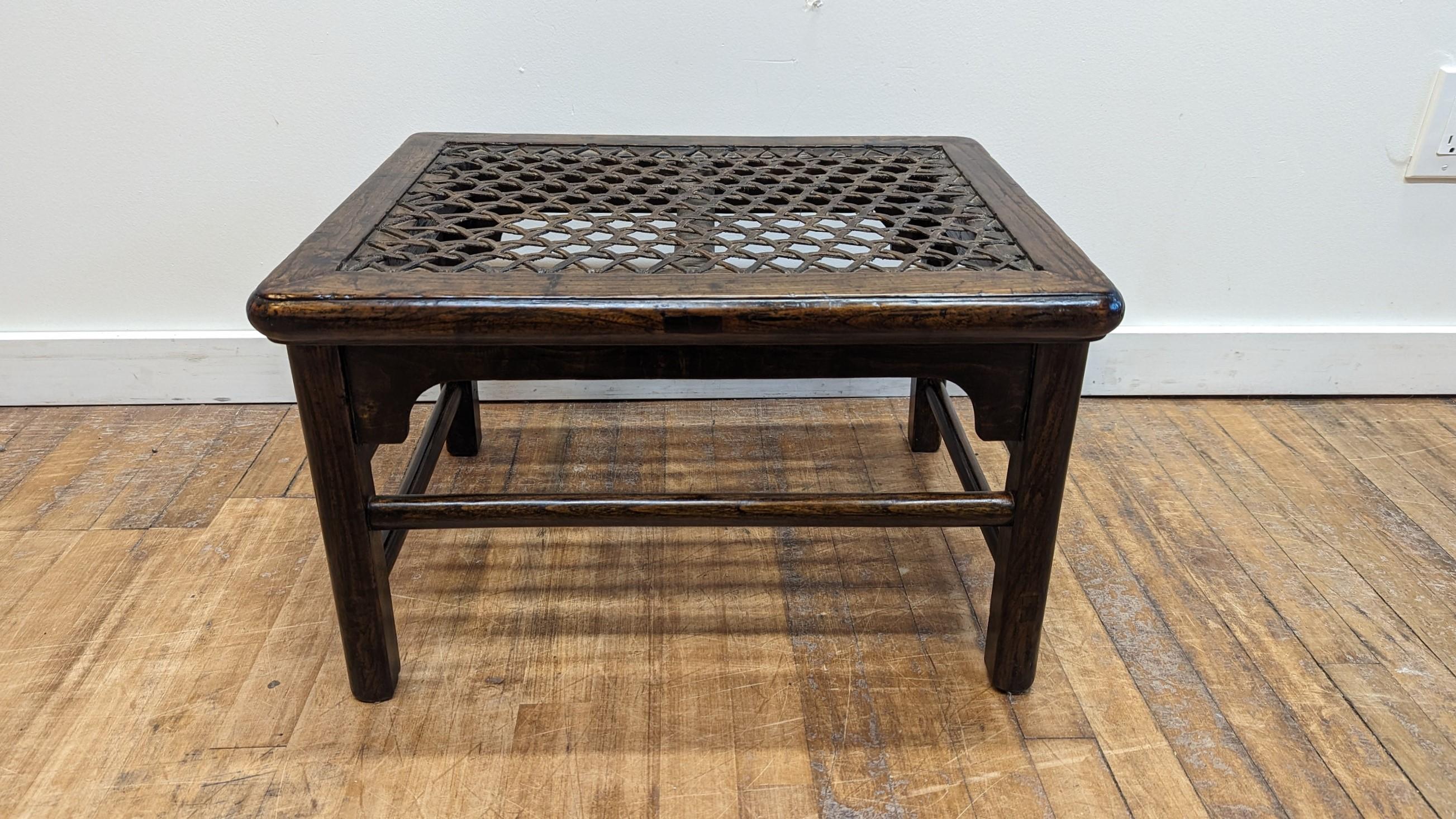 A 19th century Elm Wood Hide Woven Seat Stool.  The top of this stool is woven with incredible detail creating a pattern of stars.  The hide is cut into thick strands, incredibly strong and solid.  Woven to the recessed inset center of  the frame. 