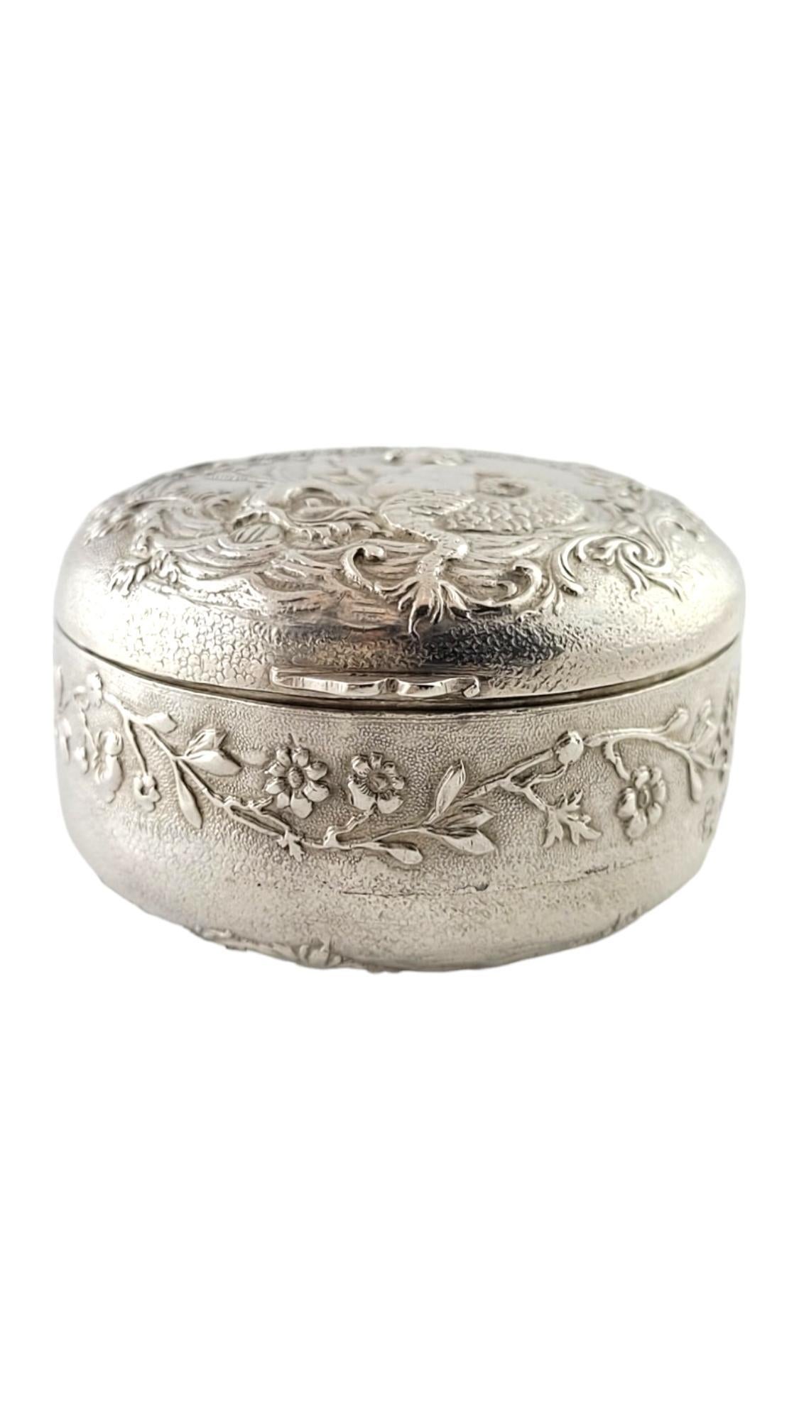 Antique Stork & Sinsheimer Hanau Germany 800 Silver Cherub Round Trinket Box

This stunning antique silver round, hinged trinket box by Stork & Sinsheimer features beautiful, meticulously crafted design of mermaid cherubs riding koi fish with