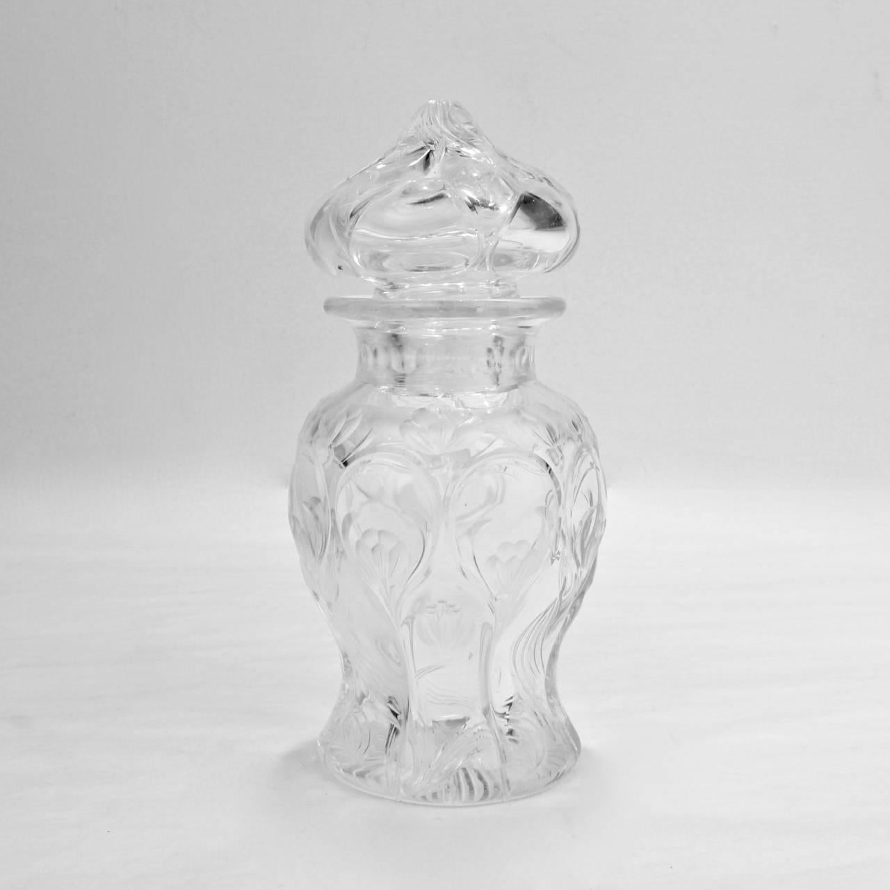 A good, antique wheel cut, 'Rock Crystal' English glass dresser jar.

With floral decoration, possibly depicting crocuses, snow drops or tulips, and stylized leafwork.

Very likely manufactured by Stevens and Williams, Thomas Webb, or one of the