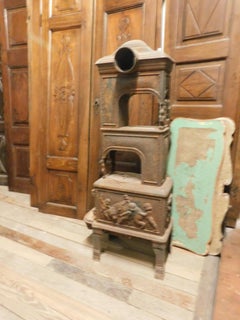Antique Stove in Cast Iron, Wood-Burning, Decor on All Sides Cherubs, 1800