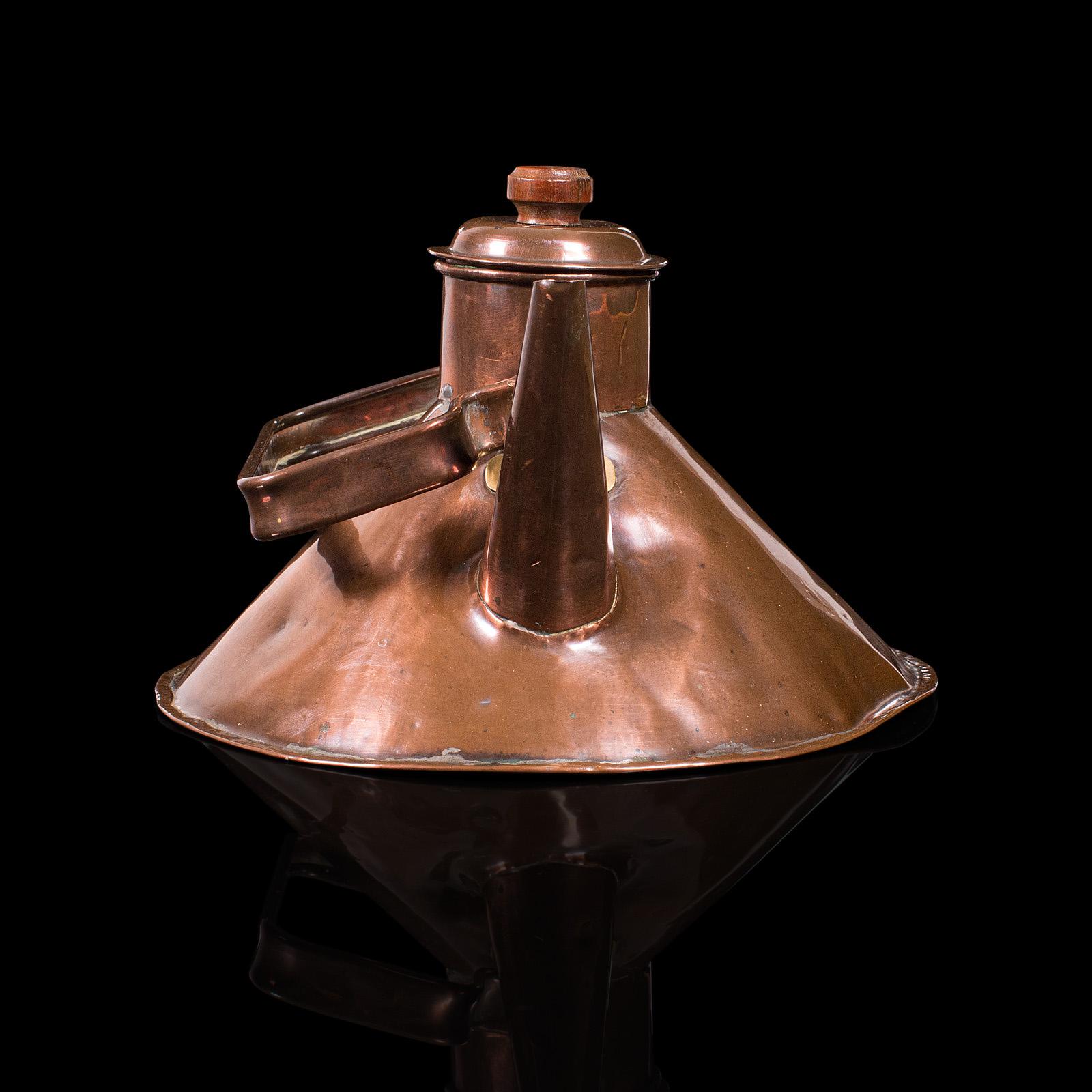 This is an antique stove kettle. An English, copper kitchen teakettle, dating to the late Victorian period, circa 1900.

Charming antique kettle with wonderful weathered appeal
Displays a desirable aged patina throughout
Patinated copper