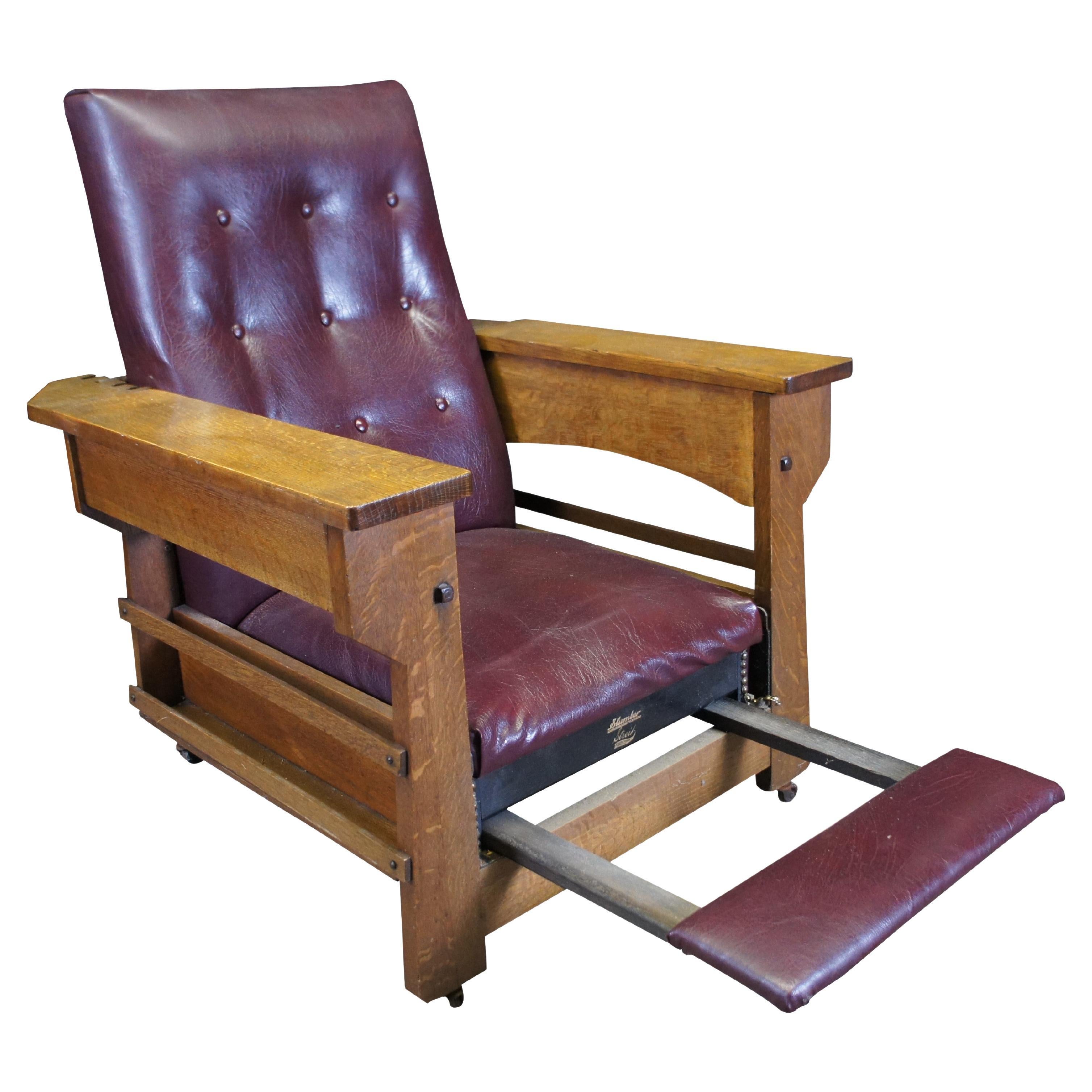 Antique Edwardian Mission / Arts & Crafts Morris Slumber chair by Streit Mfg Co, circa 1908.  Made of quartersawn oak featuring slide out footstool and wide flat armrests that open to reveal hidden storage compartments.  Each side of the chair has a