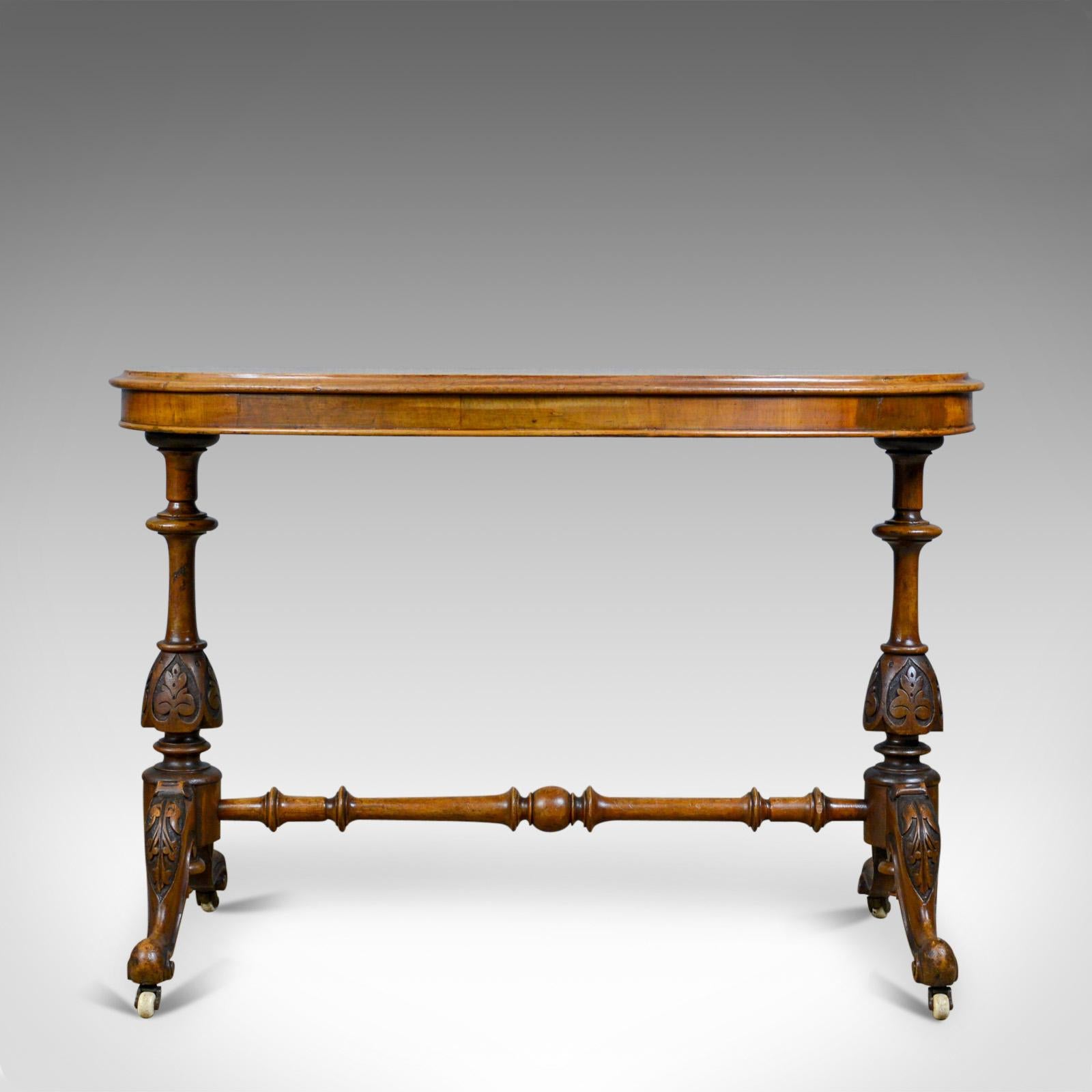 This is an antique stretcher table in burr walnut. An English, Victorian, ovular, side or tea table dating to the mid-19th century, circa 1860.

Well figured burr walnut top with molded edge detail
Beautifully quarter veneered