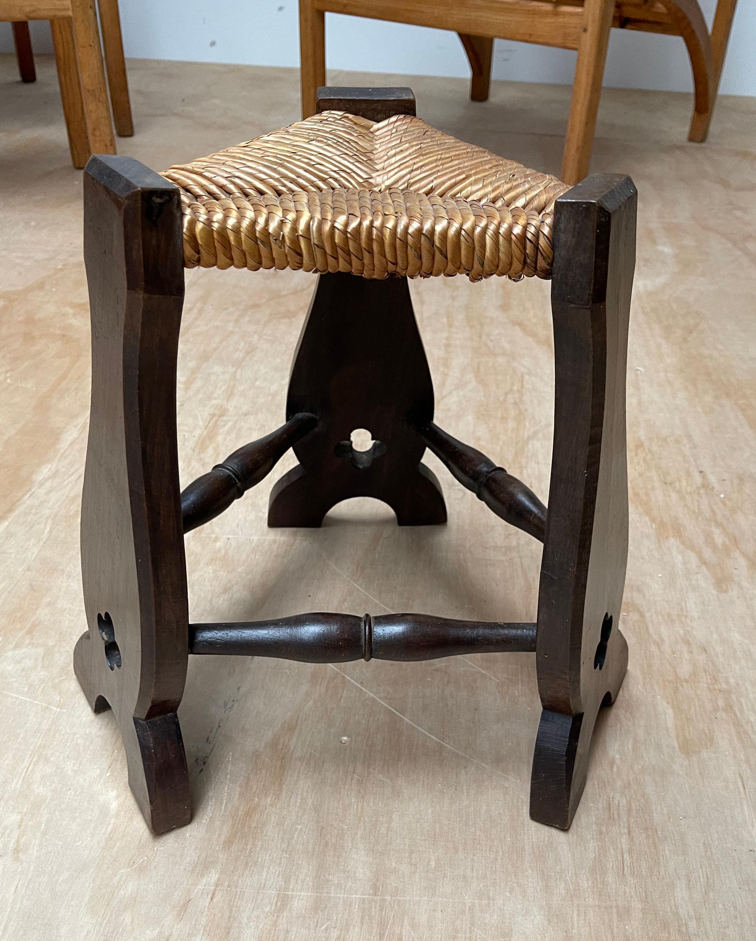 One very stylish, medieval looking, little antique stool created in the Arts & Crafts era.

In the Arts & Crafts era many artisans experimented with incorporating different styles in their designs. Without the open, Gothic quatrefoil style elements