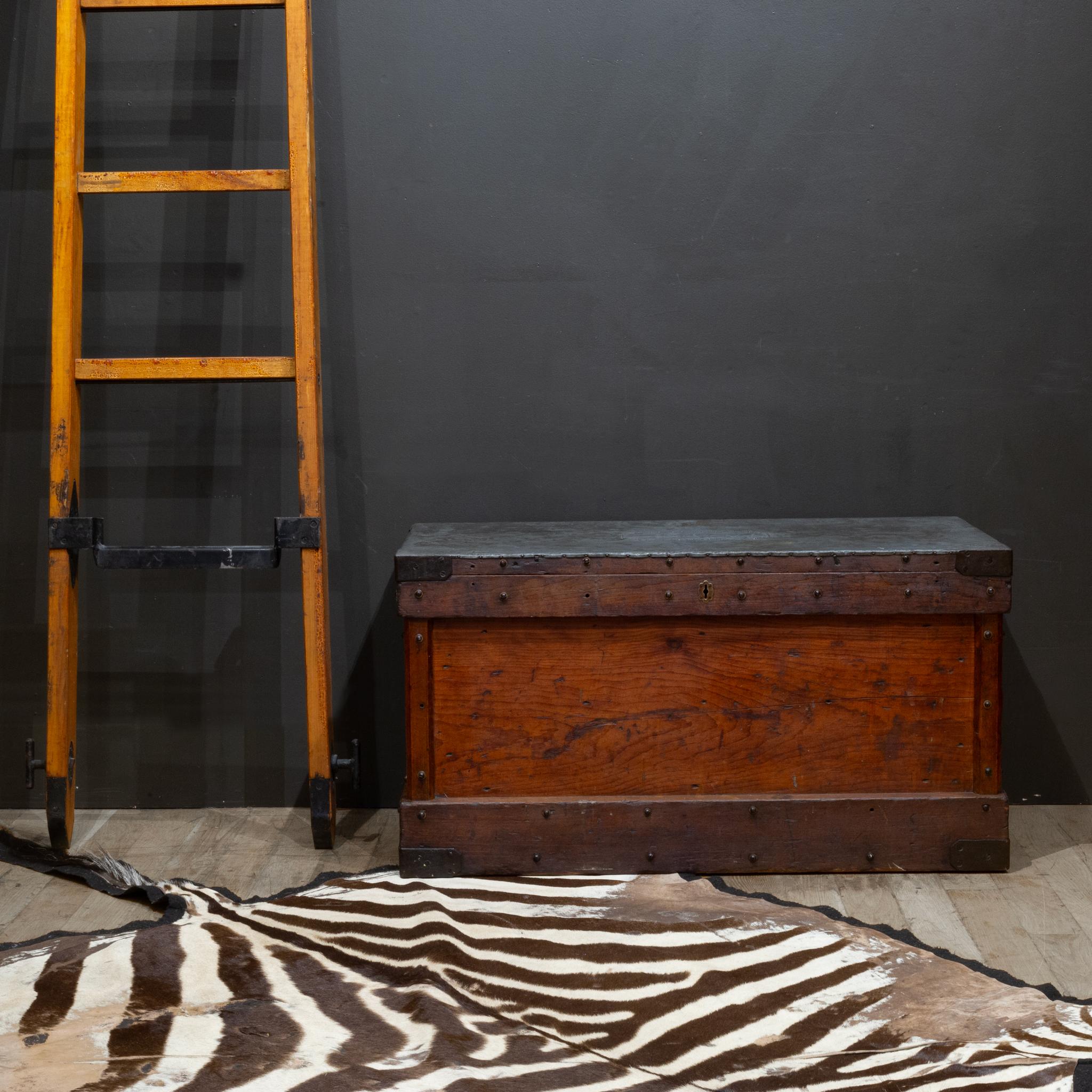 ABOUT

A handmade, antique trunk with metal top, steel corners, cast iron handles and brass key hole. Studded with bronze screws and washers on all sides. 
